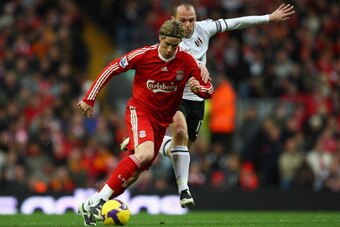 LIVERPOOL, UNITED KINGDOM - NOVEMBER 22:  Fernando Torres of Liverpool is challenged by Danny Murphy of Fulham during the Barclays Premier League match between Liverpool and Fulham at Anfield on November 22, 2008 in Liverpool, England.  (Photo by Clive Ma