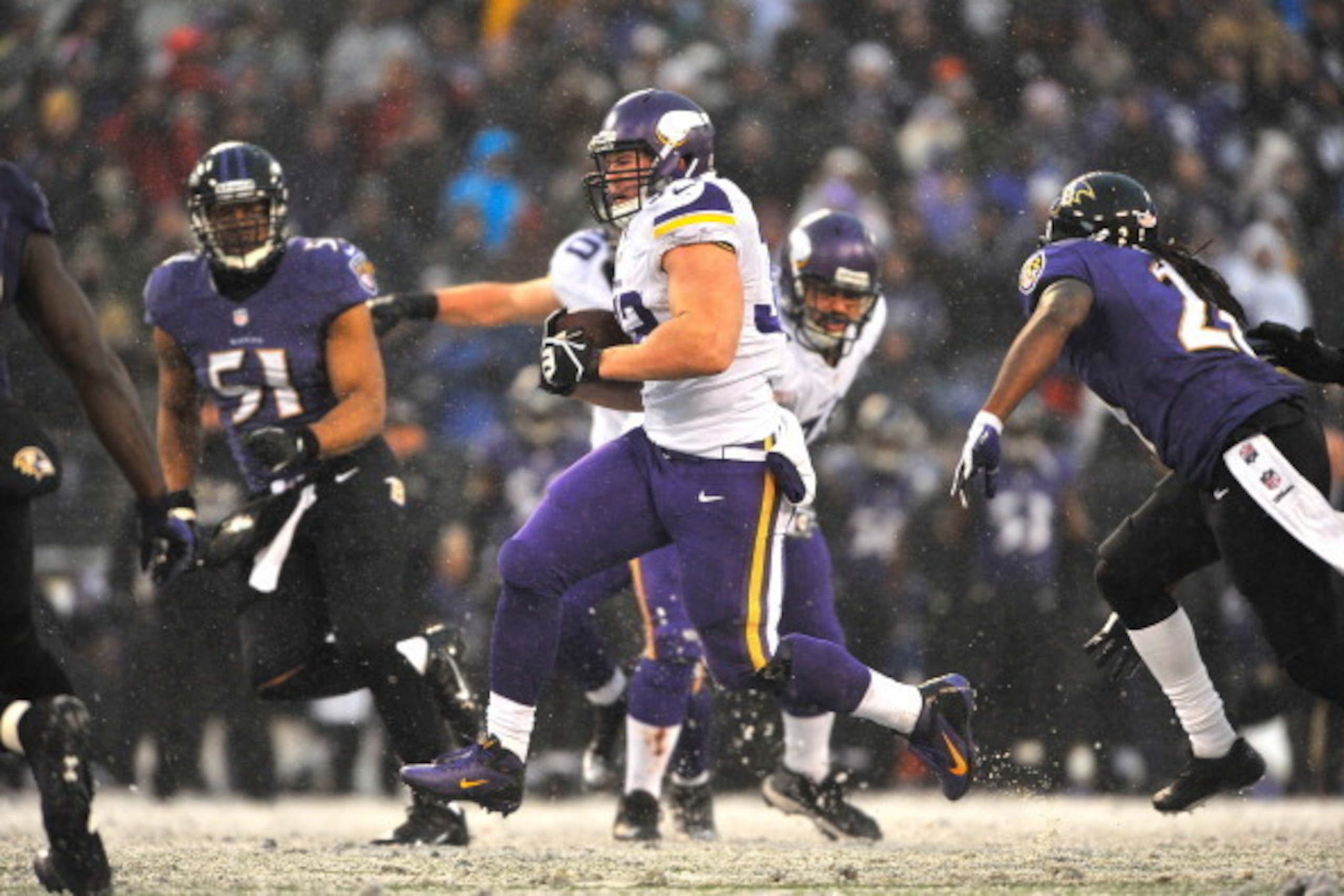 BALTIMORE, MD - DECEMBER 08:  Running back Toby Gerhart #32 of the Minnesota Vikings runs the ball in for a touchdown against the Baltimore Ravens at M&T Bank Stadium on December 8, 2013 in Baltimore, Maryland. The Ravens defeated the Vikings 29-26.  (Pho