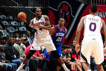 ATLANTA, GA - MARCH 31: Paul Millsap #4 of the Atlanta Hawks passes the ball against the Philadelphia 76ers on March 31, 2014 at Philips Arena in Atlanta, Georgia.  NOTE TO USER: User expressly acknowledges and agrees that, by downloading and/or using thi