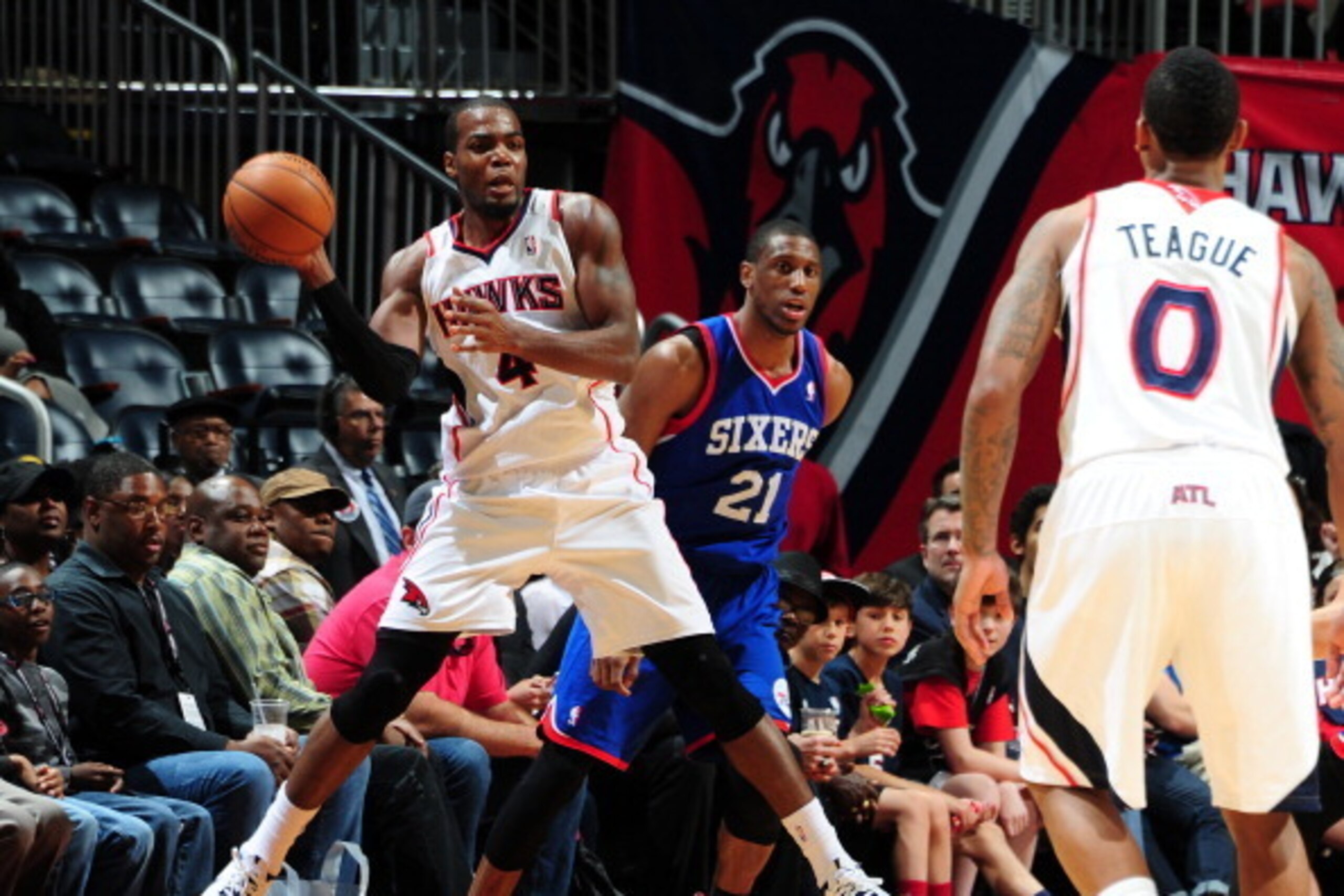 ATLANTA, GA - MARCH 31: Paul Millsap #4 of the Atlanta Hawks passes the ball against the Philadelphia 76ers on March 31, 2014 at Philips Arena in Atlanta, Georgia.  NOTE TO USER: User expressly acknowledges and agrees that, by downloading and/or using thi