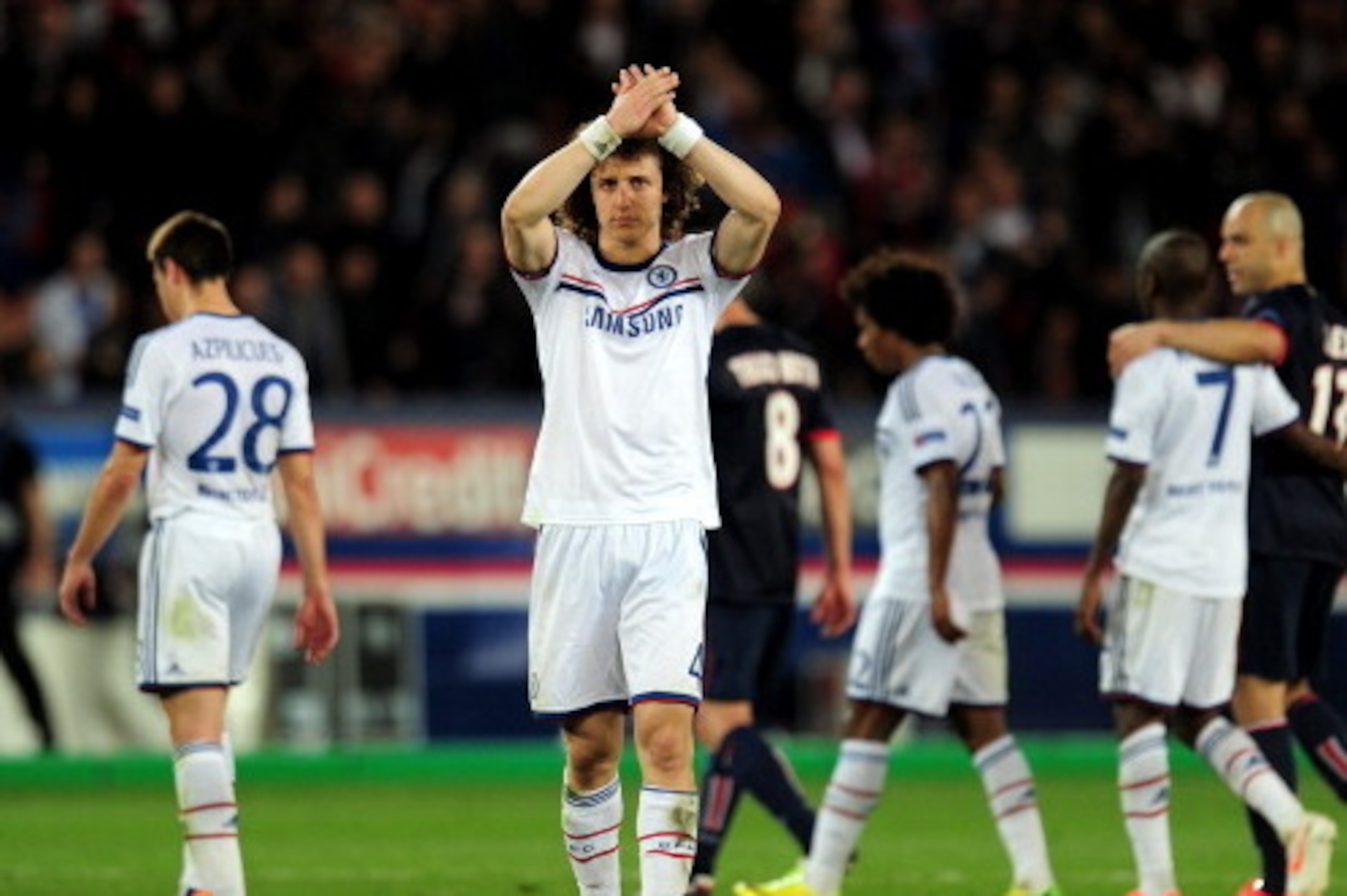 PARIS, FRANCE - APRIL 02:  A dejected David Luiz of Chelsea applauds the travelling fans following his team's 3-1 defeat during the UEFA Champions League quarter final, first leg match between Paris Saint Germain and Chelsea at Parc des Princes on April 2