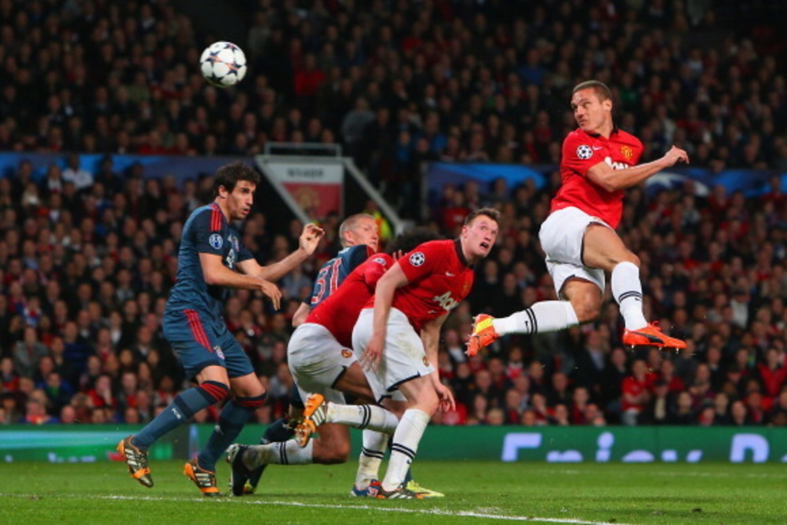 MANCHESTER, ENGLAND - APRIL 01:  Nemanja Vidic of Manchester United heads in the first goal during the UEFA Champions League Quarter Final first leg match between Manchester United and FC Bayern Muenchen at Old Trafford on April 1, 2014 in Manchester, Eng