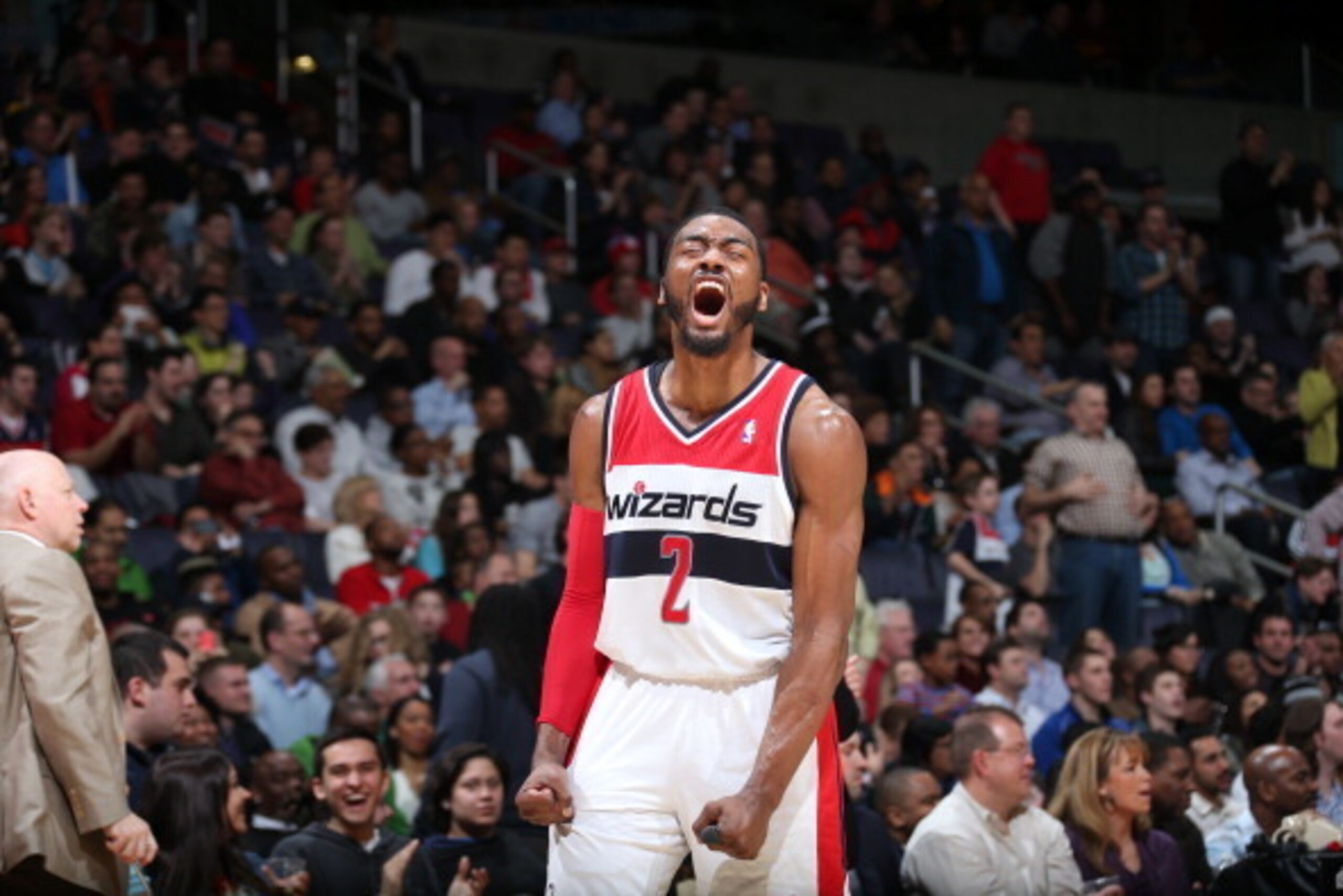 WASHINGTON, DC - MARCH 29: John Wall #2 of the Washington Wizards celebrates during a game against the Atlanta Hawks at the Verizon Center on March 29, 2014 in Washington, DC. NOTE TO USER: User expressly acknowledges and agrees that, by downloading and o