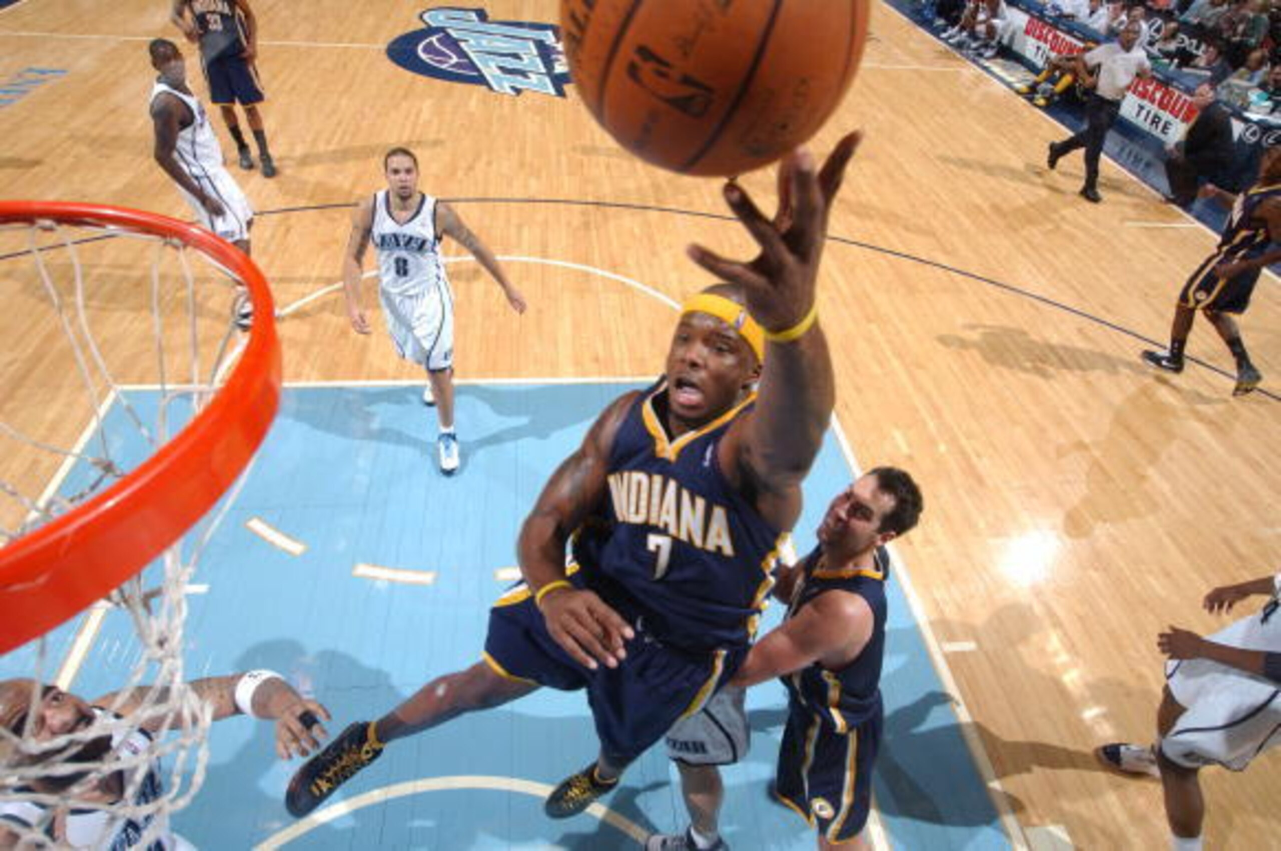 SALT LAKE CITY - JANUARY 08:  Jermaine O'Neal #7 of the Indiana Pacers hits a turnaround jumper over Carlos Boozer #5 of the Utah Jazz at EnergySolutions Arena on January 8, 2008 in Salt Lake City, Utah. NOTE TO USER: User expressly acknowledges and agree