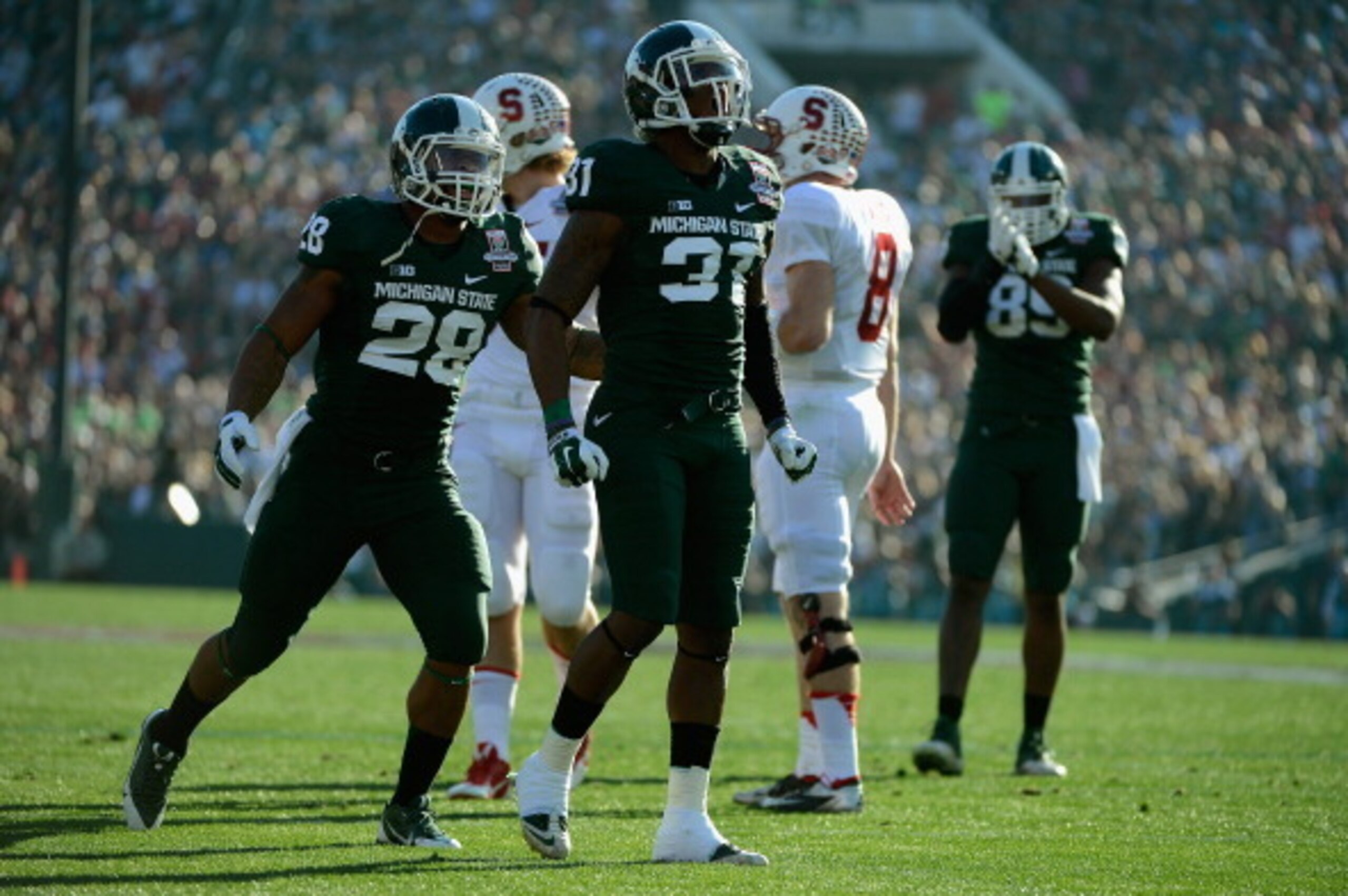 PASADENA, CA - JANUARY 01:  Cornerback Darqueze Dennard #31 of the Michigan State Spartans celebrates after a play against the Stanford Cardinal during the 100th Rose Bowl Game presented by Vizio at the Rose Bowl on January 1, 2014 in Pasadena, California