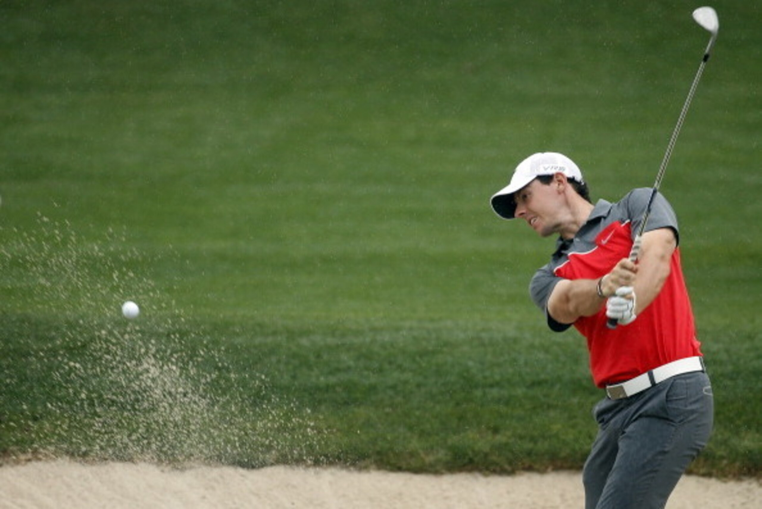 HUMBLE, TX - APRIL 03:  Rory McIlroy of Northern Ireland hits a shot out of the bunker on the eighth hole during round one of the Shell Houston Open at the Golf Club of Houston on April 3, 2014 in Humble, Texas.  (Photo by Scott Halleran/Getty Images)