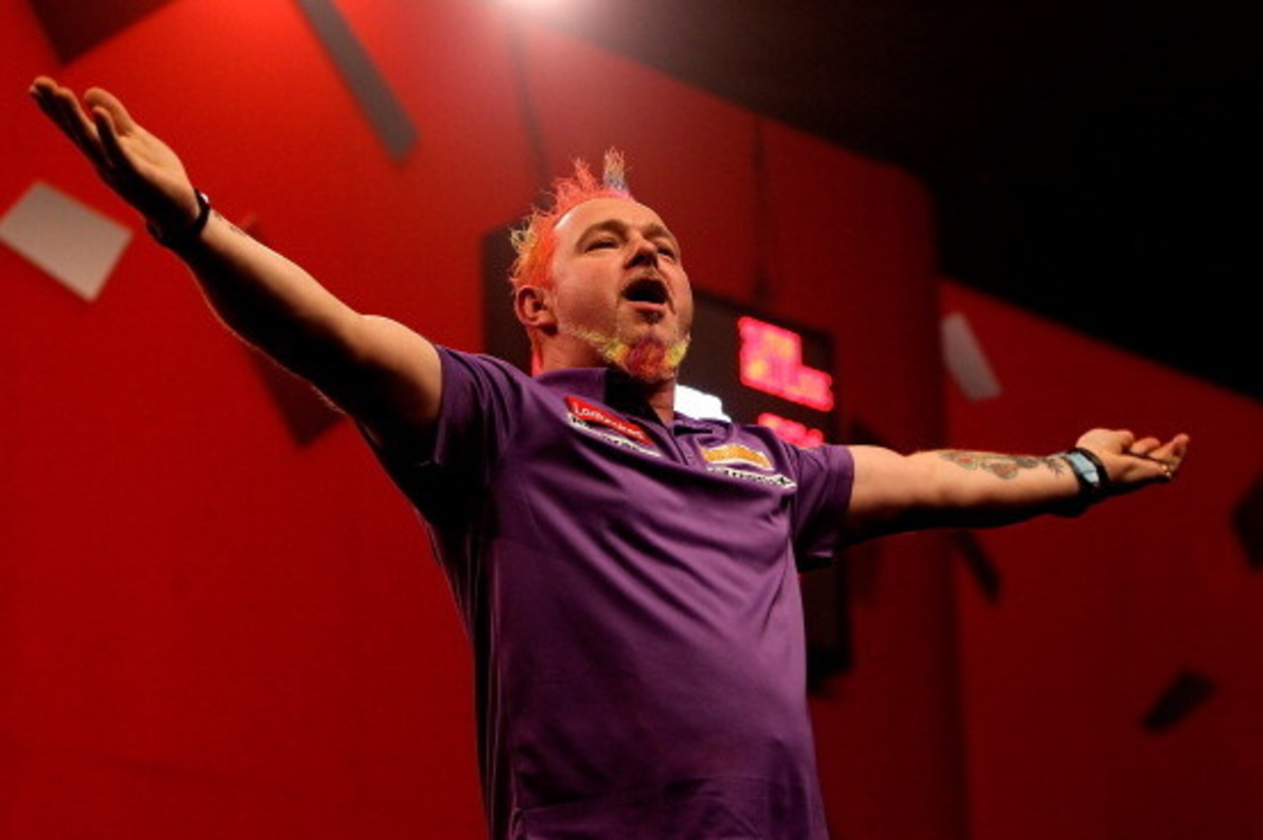 LONDON, ENGLAND - DECEMBER 30:  Peter Wright of Scotland celebrates defeating Simon Whitlock of Australia in their semi final match on day fifteen of the Ladbrokes.com World Darts Championship at Alexandra Palace on December 30, 2013 in London, England.  