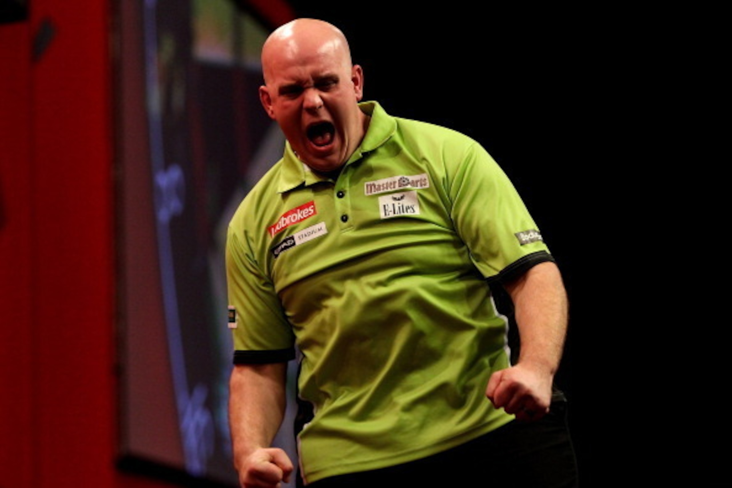 LONDON, ENGLAND - JANUARY 01:  Michael van Gerwen of The Netherlands celebrates after winning a set during the final of the Ladbrokes.com World Darts Championships at Alexandra Palace on January 1, 2014 in London, England.  (Photo by Ben Hoskins/Getty Ima