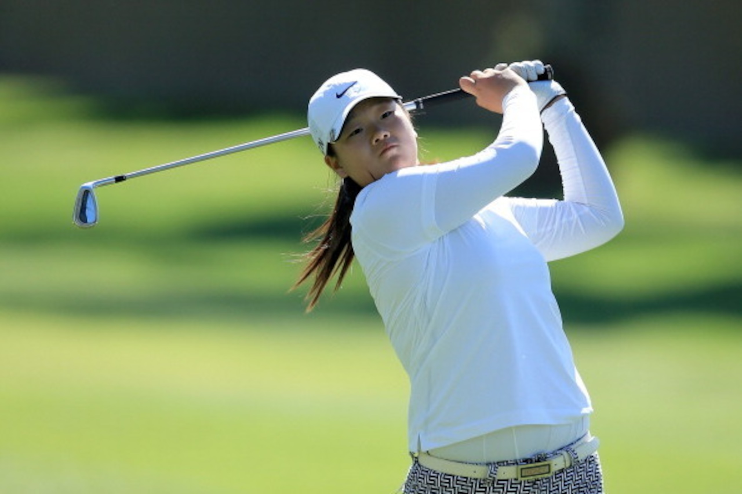 RANCHO MIRAGE, CA - APRIL 03:  Angel Yin of the USA plays her second shot at the par 4, 15th hole during the first round of the 2014  Kraft Nabisco Championship on the Dinah Shore Tournament Course at Mission Hills Country Club on April 3, 2014 in Rancho 