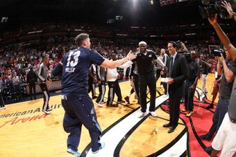 MIAMI, FL - MARCH 21: Mike Miller #13 of the Memphis Grizzlies slaps hands with LeBron James #6 of the Miami Heat before a game on March 21, 2014 at American Airlines Arena in Miami, Florida. NOTE TO USER: User expressly acknowledges and agrees that, by d