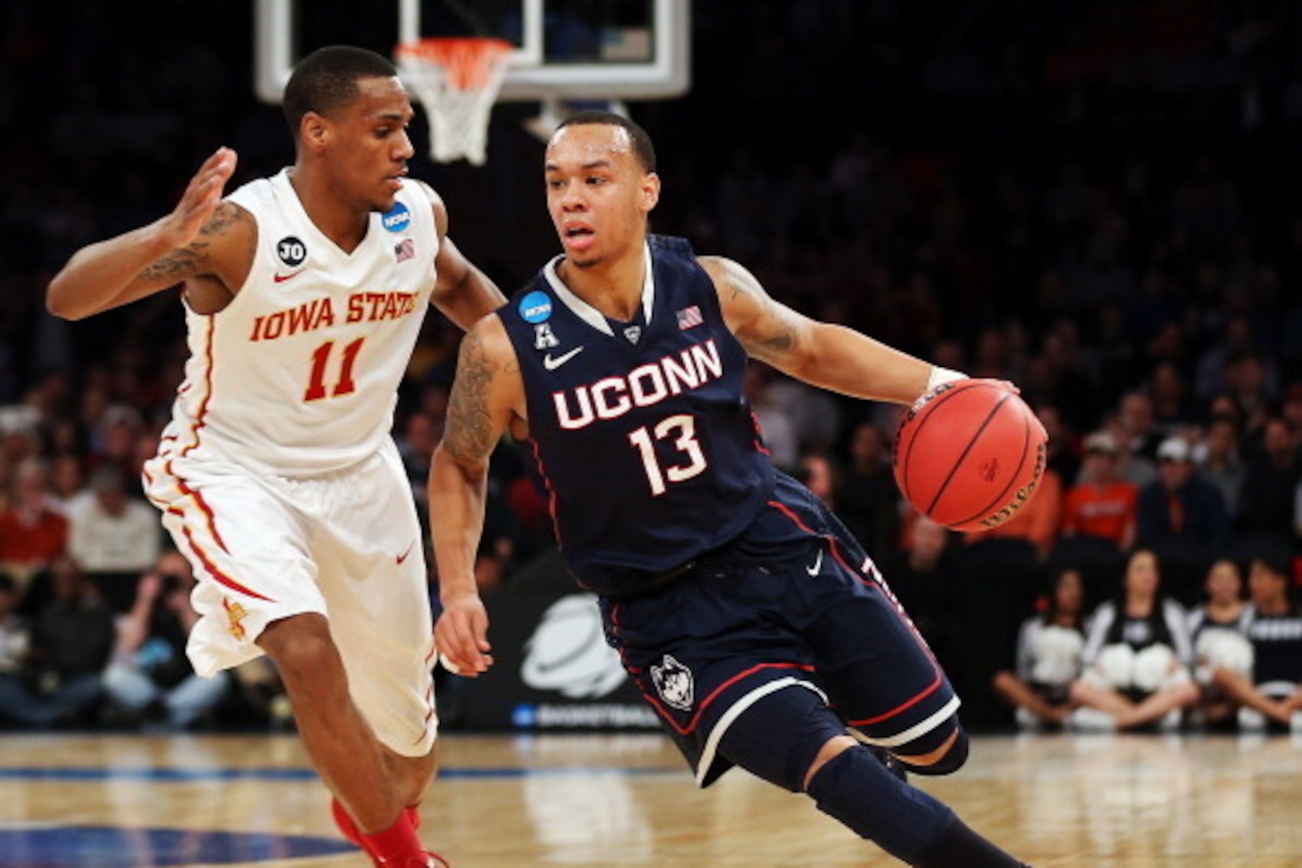 NEW YORK, NY - MARCH 28:  Shabazz Napier #13 of the Connecticut Huskies handles the ball against Monte Morris #11 of the Iowa State Cyclones during the regional semifinal of the 2014 NCAA Men's Basketball Tournament at Madison Square Garden on March 28, 2