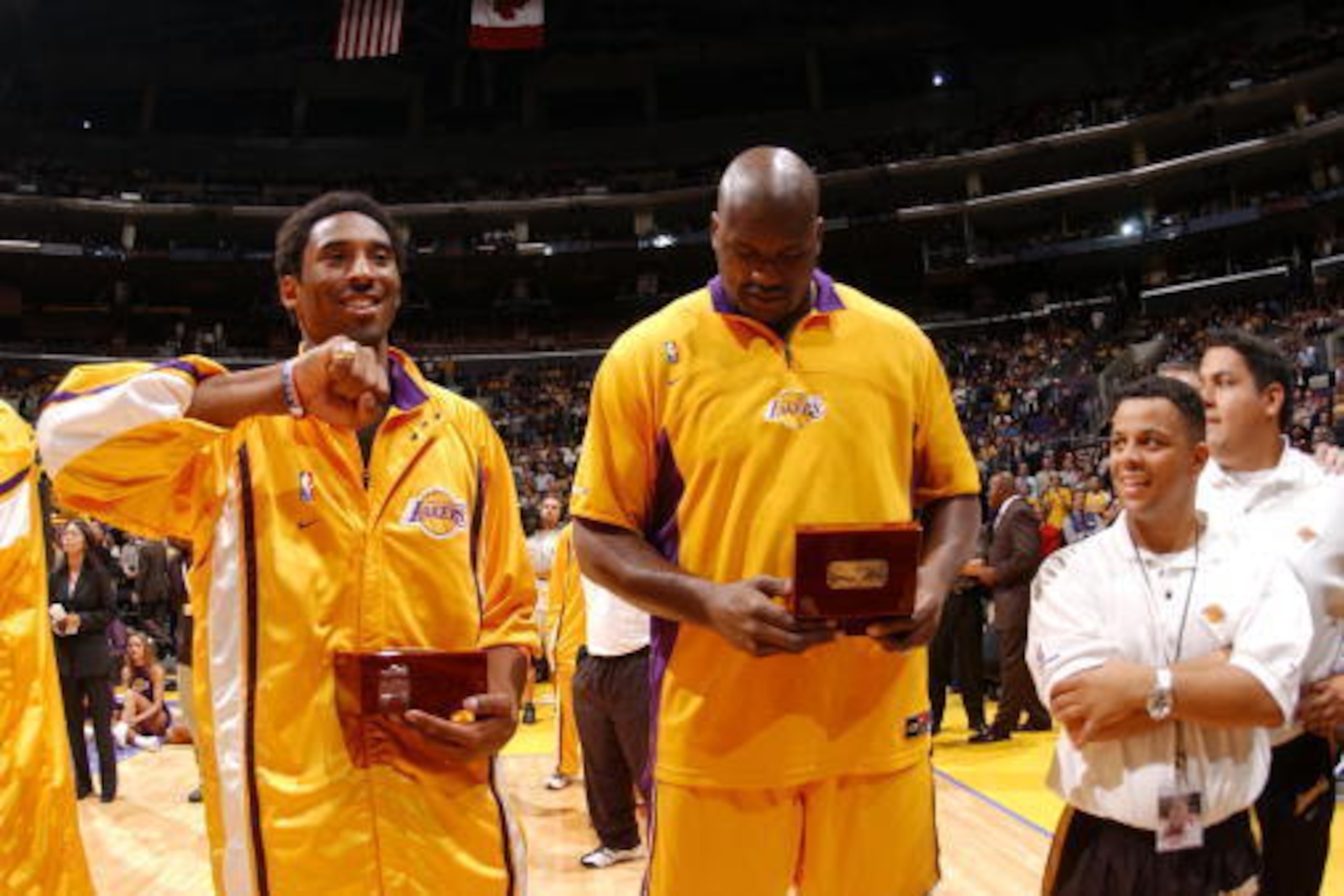 30 Oct 2001: Kobe Bryant #8 and Shaquille O''Neal #34 of the Los Angeles Lakers look at their Championship ring before the game against the Portland Trailblazers at Staples Center in Los Angeles, California. DIGITAL IMAGE. NOTE TO USER: User expressly 30 Oct 2001: Kobe Bryant #8 and Shaquille O''Neal #34 of the Los Angeles Lakers look at their Championship ring before the game against the Portland Trailblazers at Staples Center in Los Angeles, California. DIGITAL IMAGE. NOTE TO USER: User expressly