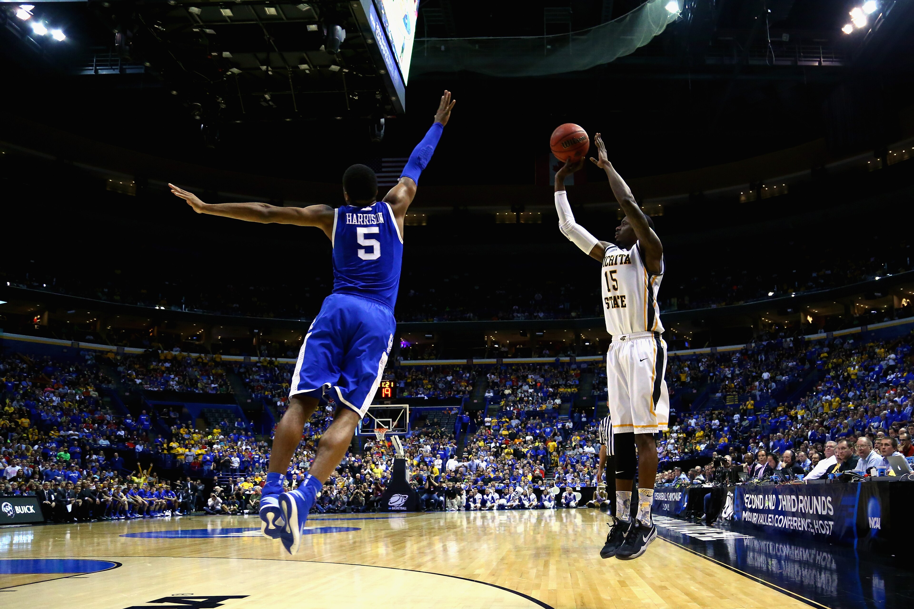 ST LOUIS, MO - MARCH 23:  Nick Wiggins #15 of the Wichita State Shockers shoots the ball against Andrew Harrison #5 of the Kentucky Wildcats during the third round of the 2014 NCAA Men's Basketball Tournament at Scottrade Center on March 23, 2014 in St Lo
