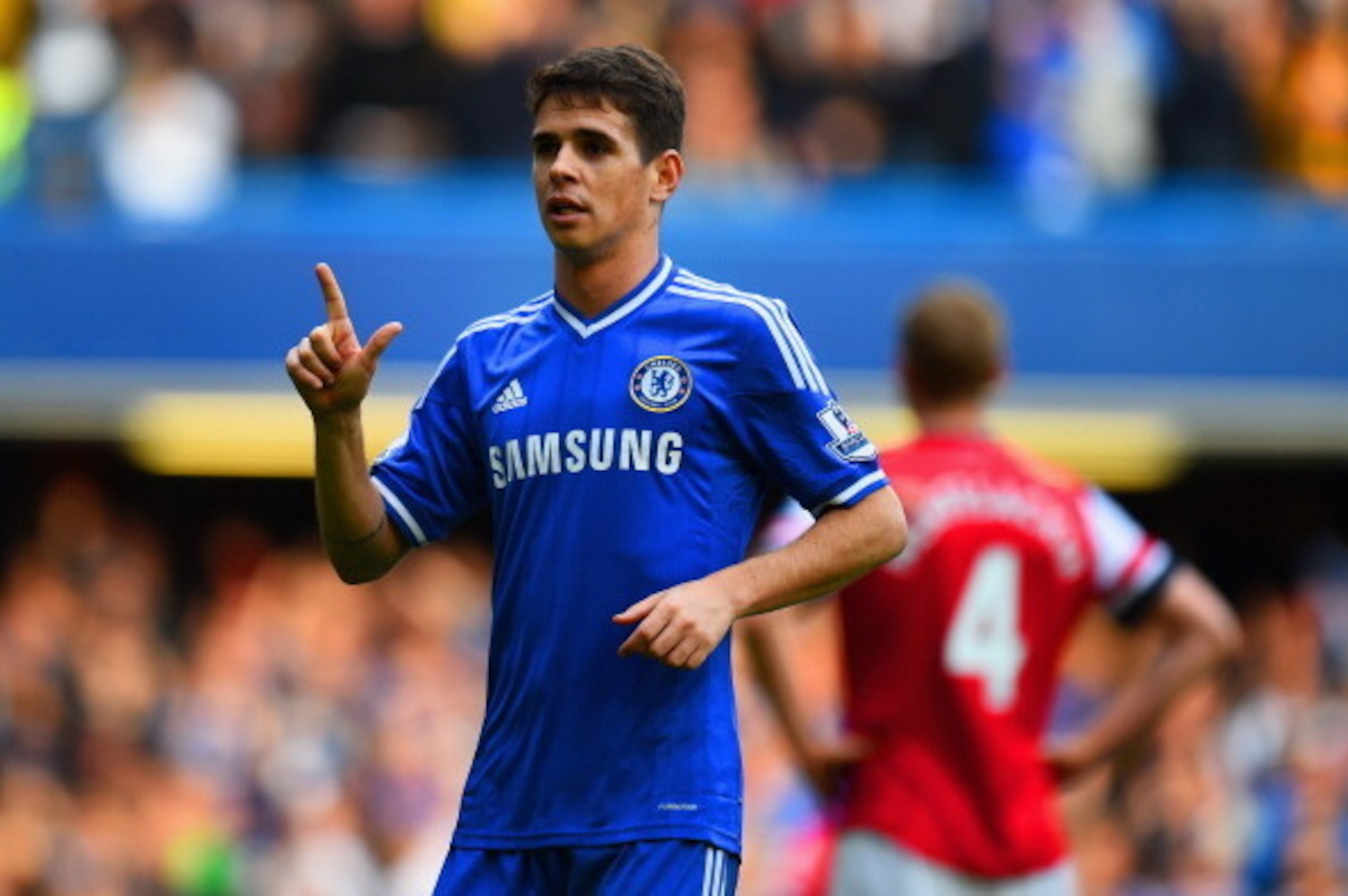 LONDON, ENGLAND - MARCH 22:  Oscar of Chelsea celebrates scoring their fifth goal during the Barclays Premier League match between Chelsea and Arsenal at Stamford Bridge on March 22, 2014 in London, England.  (Photo by Shaun Botterill/Getty Images)