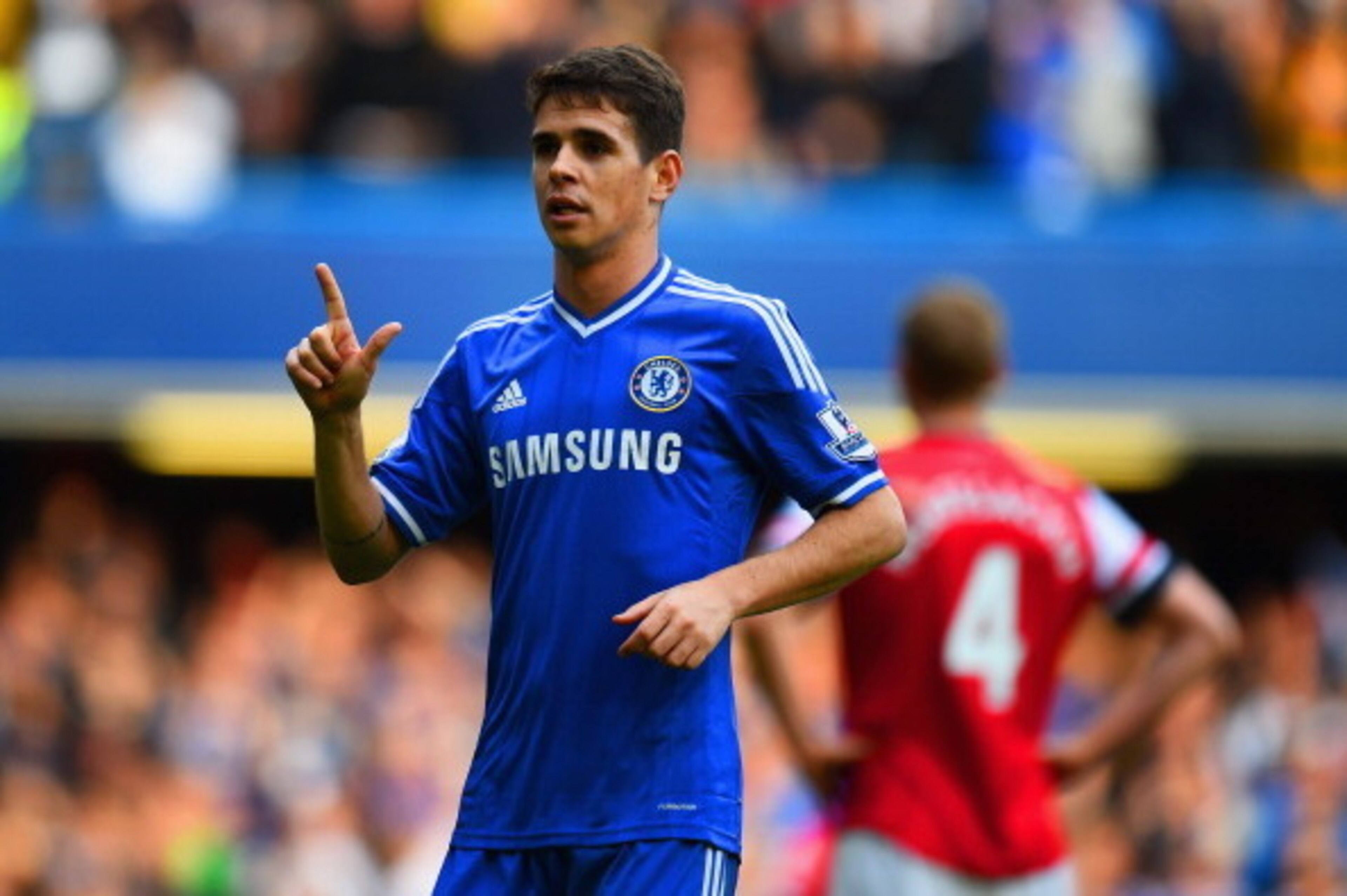 LONDON, ENGLAND - MARCH 22:  Oscar of Chelsea celebrates scoring their fifth goal during the Barclays Premier League match between Chelsea and Arsenal at Stamford Bridge on March 22, 2014 in London, England.  (Photo by Shaun Botterill/Getty Images)