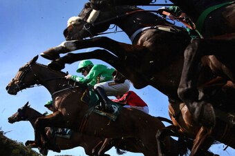 LIVERPOOL, ENGLAND - APRIL 06:  Tour Des Champs ridden by Sam Twiston-Davies jumps a fence during The John Smith's Handicap Steeple Chase at Aintree Racecourse on April 6, 2013 in Liverpool, England.  (Photo by Alex Livesey/Getty Images)