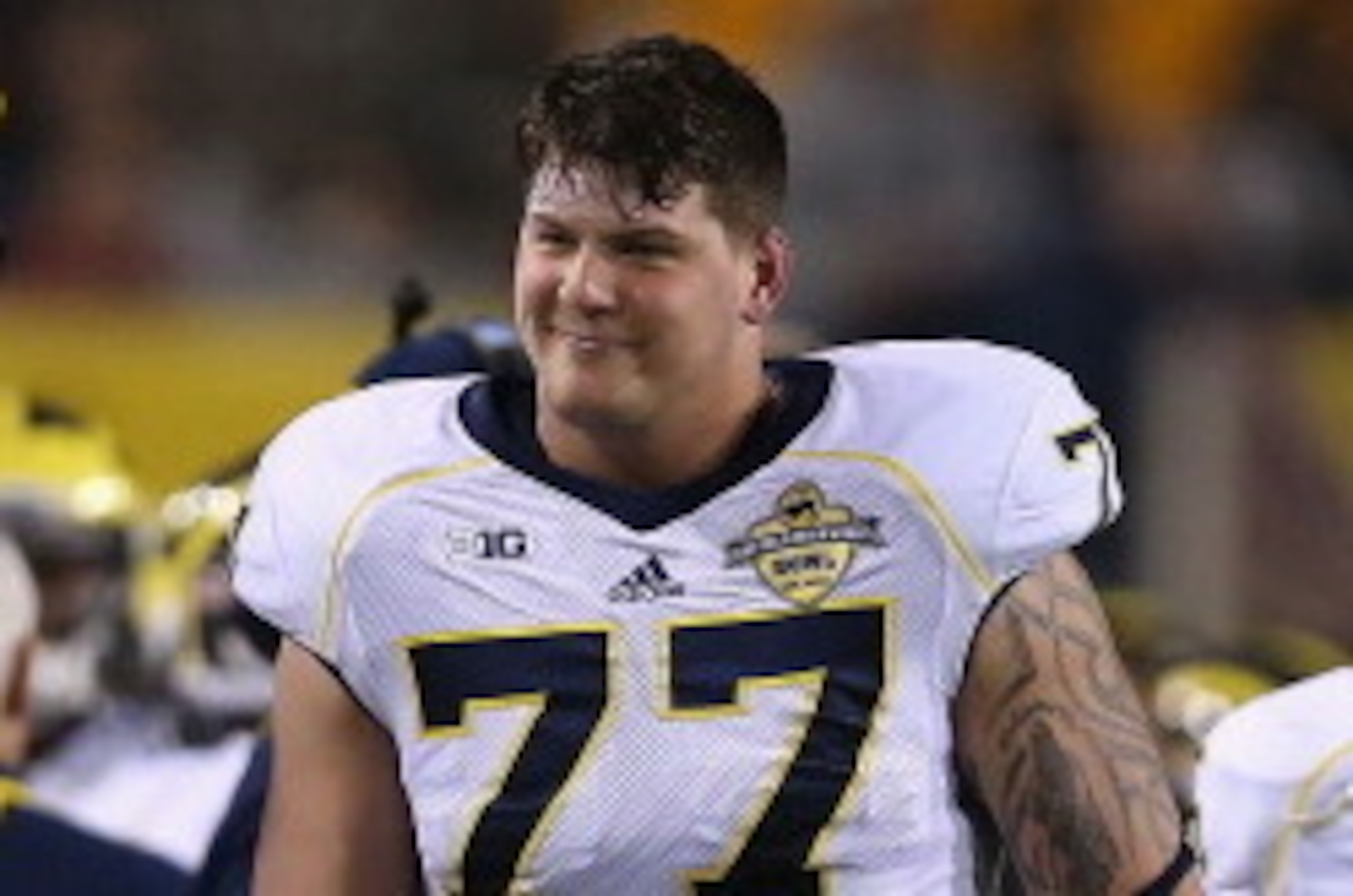 TEMPE, AZ - DECEMBER 28:  Offensive linesman Taylor Lewan #77 of the Michigan Wolverines on the sidelines during the Buffalo Wild Wings Bowl against the Kansas State Wildcats at Sun Devil Stadium on December 28, 2013 in Tempe, Arizona. The Wildcats defeat