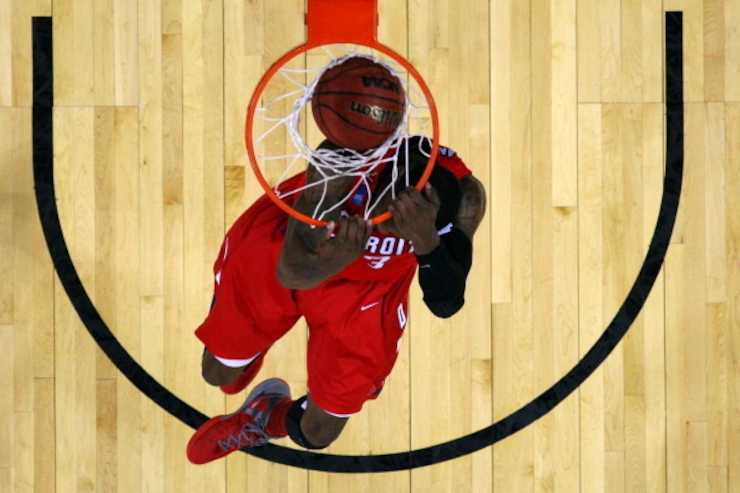 OMAHA, NE - MARCH 16:  Doug Anderson #23 of the Detroit Titans dunks in the first half against the Kansas Jayhawks during the second round of the 2012 NCAA Men's Basketball Tournament at CenturyLink Center on March 16, 2012 in Omaha, Nebraska.  (Photo by 