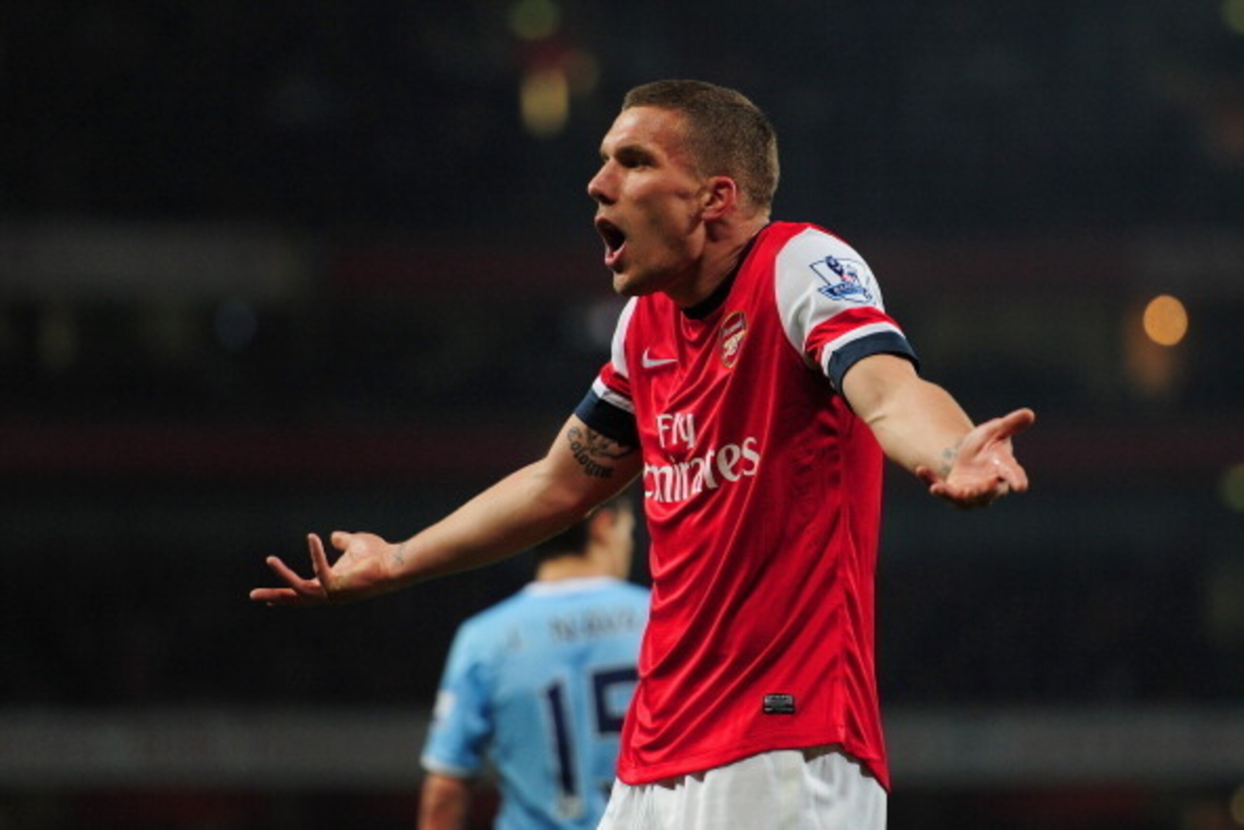 LONDON, ENGLAND - MARCH 29: Lukas Podolski of Arsenal reacts during the Barclays Premier League match between Arsenal and Manchester City at Emirates Stadium on March 29, 2014 in London, England. (Photo by Shaun Botterill/Getty Images) LONDON, ENGLAND - MARCH 29: Lukas Podolski of Arsenal reacts during the Barclays Premier League match between Arsenal and Manchester City at Emirates Stadium on March 29, 2014 in London, England. (Photo by Shaun Botterill/Getty Images)