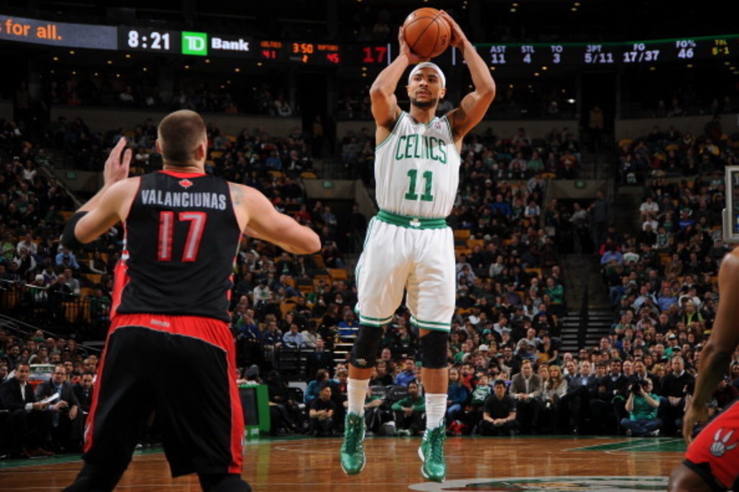 BOSTON, MA - MARCH 26: Jerryd Bayless #11 of the Boston Celtics shoots against the Toronto Raptors on March 26, 2014 at the TD Garden in Boston, Massachusetts.  NOTE TO USER: User expressly acknowledges and agrees that, by downloading and or using this ph
