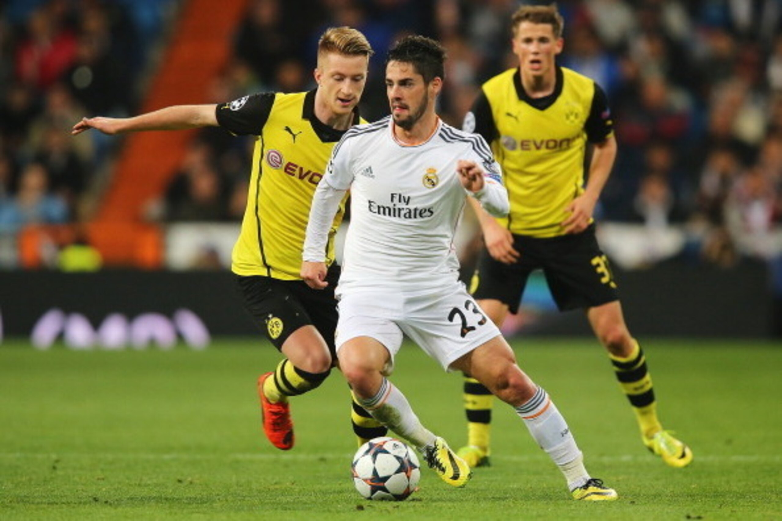 MADRID, SPAIN - APRIL 02:  Isco of Real Madrid is closed down by Marco Reus (L) of Borussia Dortmund during the UEFA Champions League Quarter Final first leg match between Real Madrid and Borussia Dortmund at Estadio Santiago Bernabeu on April 2, 2014 in 