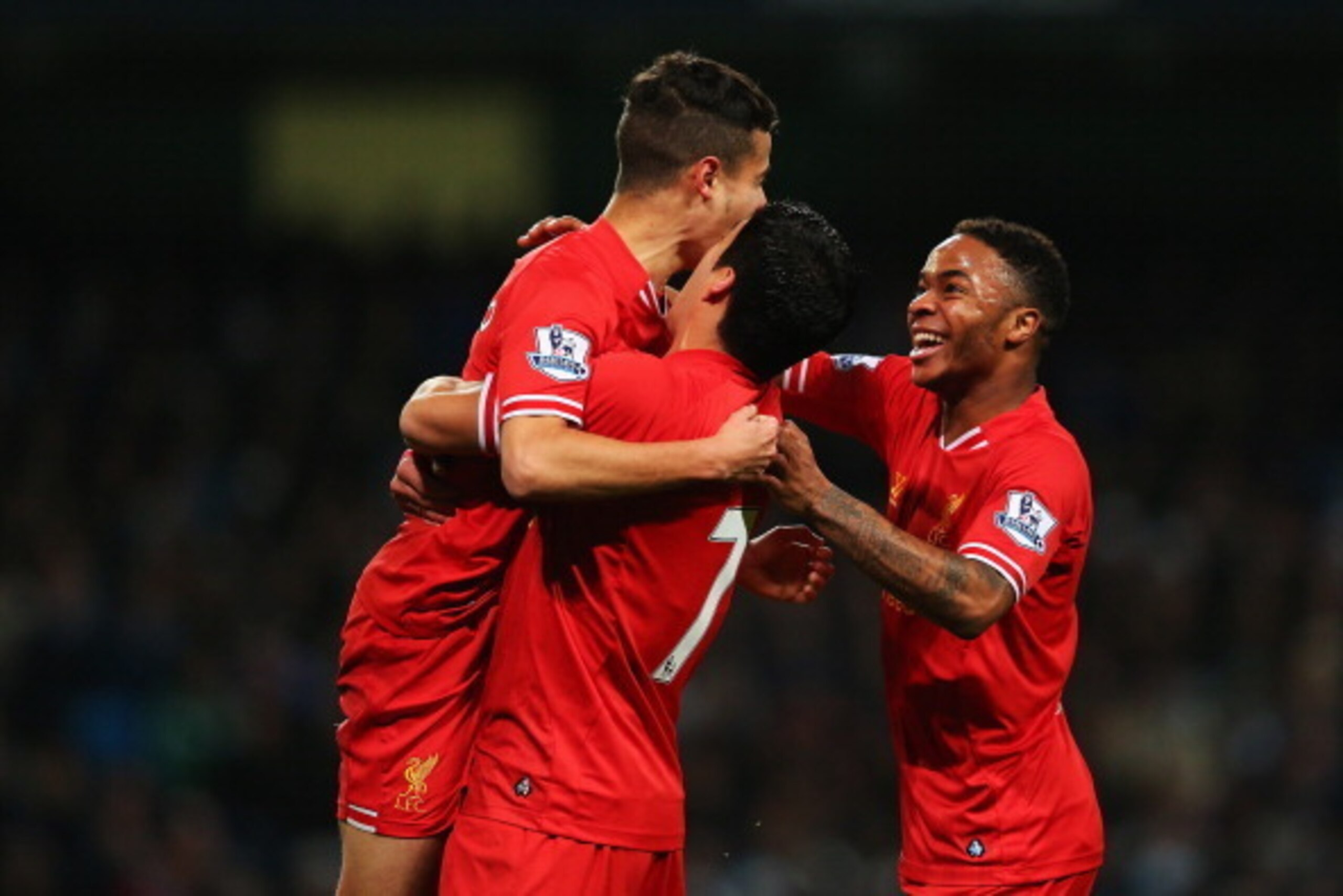 MANCHESTER, ENGLAND - DECEMBER 26: Luis Suarez (C) and Raheem Sterling (R) of Liverpool congratulate goalscorer Philippe Coutinho during the Barclays Premier League match between Manchester City and Liverpool at Etihad Stadium on December 26, 2013 in Man MANCHESTER, ENGLAND - DECEMBER 26: Luis Suarez (C) and Raheem Sterling (R) of Liverpool congratulate goalscorer Philippe Coutinho during the Barclays Premier League match between Manchester City and Liverpool at Etihad Stadium on December 26, 2013 in Man