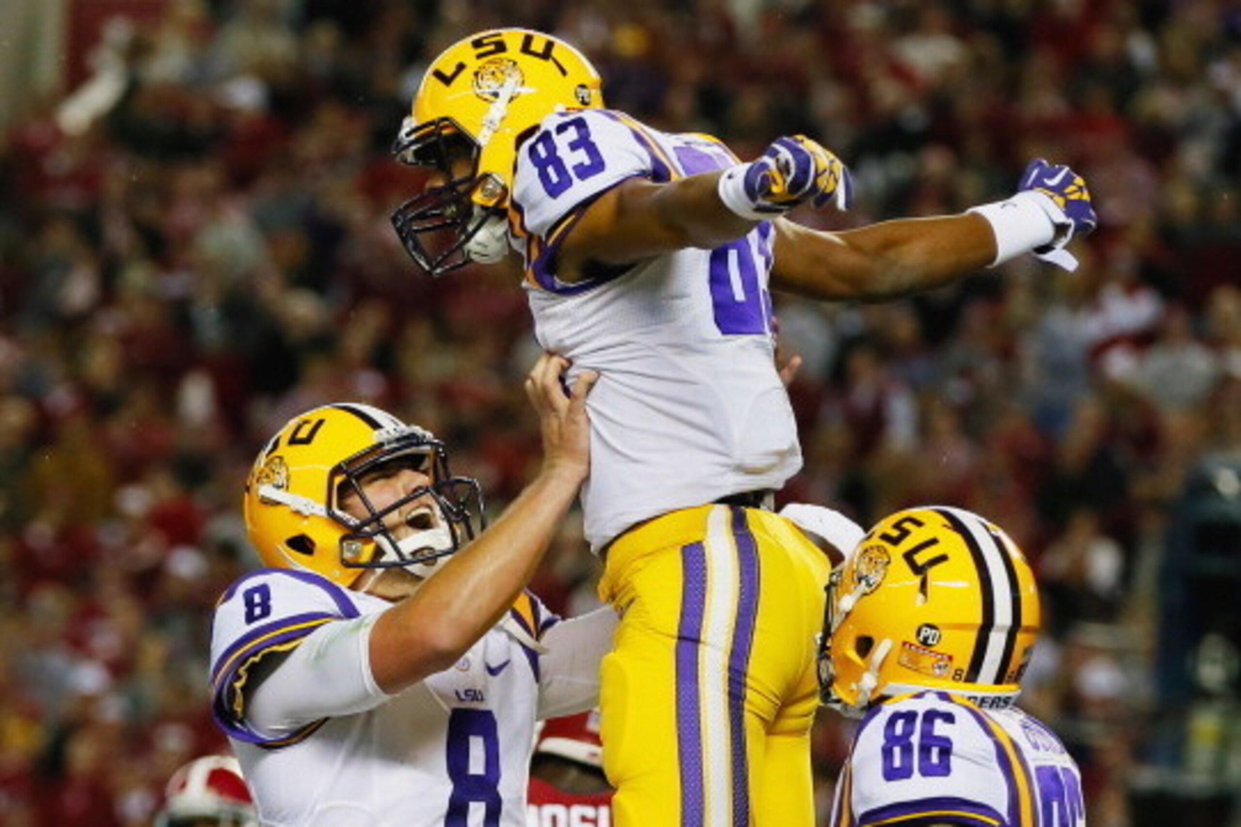 TUSCALOOSA, AL - NOVEMBER 09:  Travin Dural #83 of the LSU Tigers celebrates his touchdown reception with teammate Zach Mettenberger #8 in the second quarter against the Alabama Crimson Tide at Bryant-Denny Stadium on November 9, 2013 in Tuscaloosa, Alaba