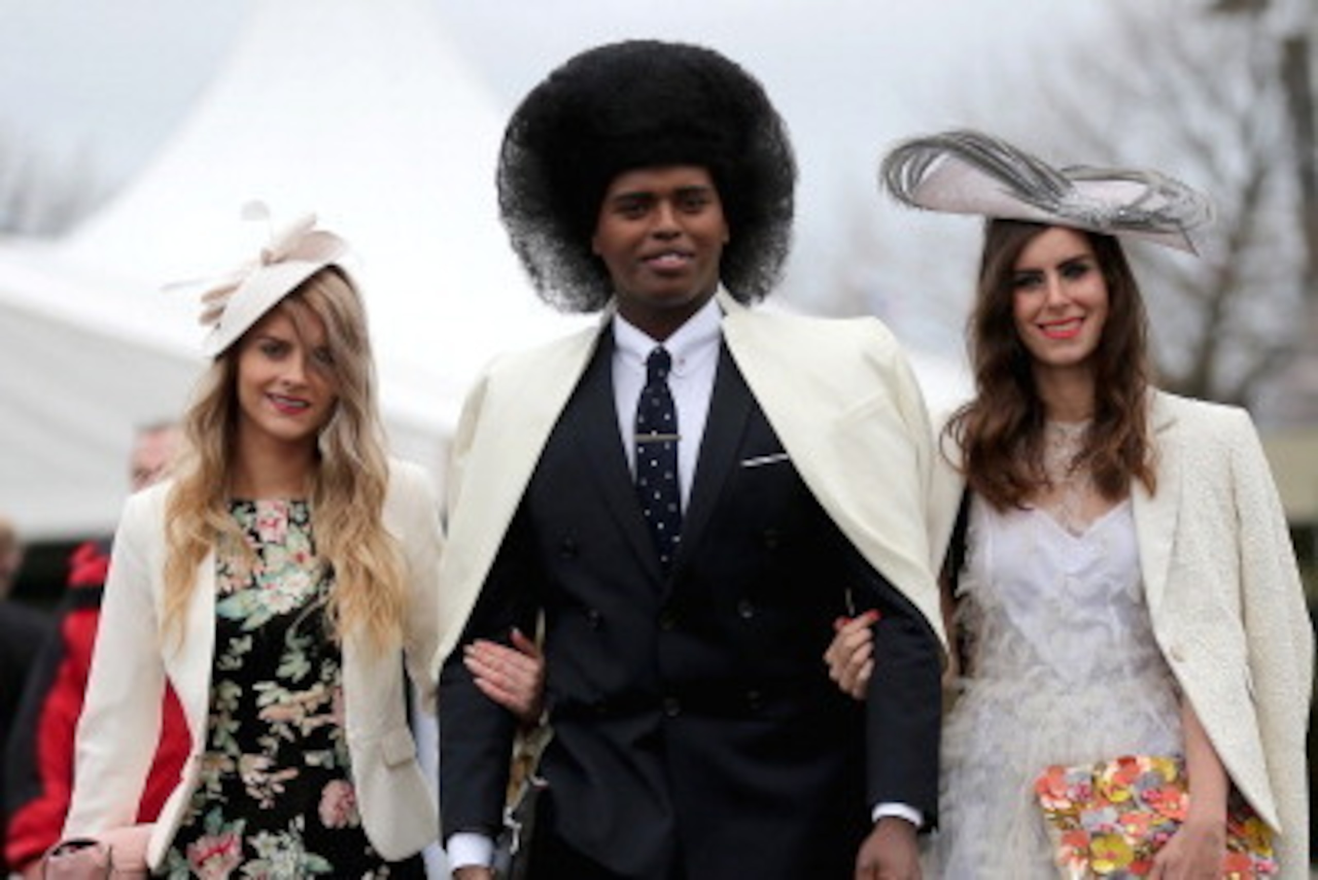 AINTREE, ENGLAND - APRIL 04:  Racegoers enjoy the atmosphere of Ladies Day and dress to impress at the Aintree Grand National Festival meeting on April 4, 2014 in Aintree, England. Friday is traditionally Ladies day at the three-day meeting of the world f
