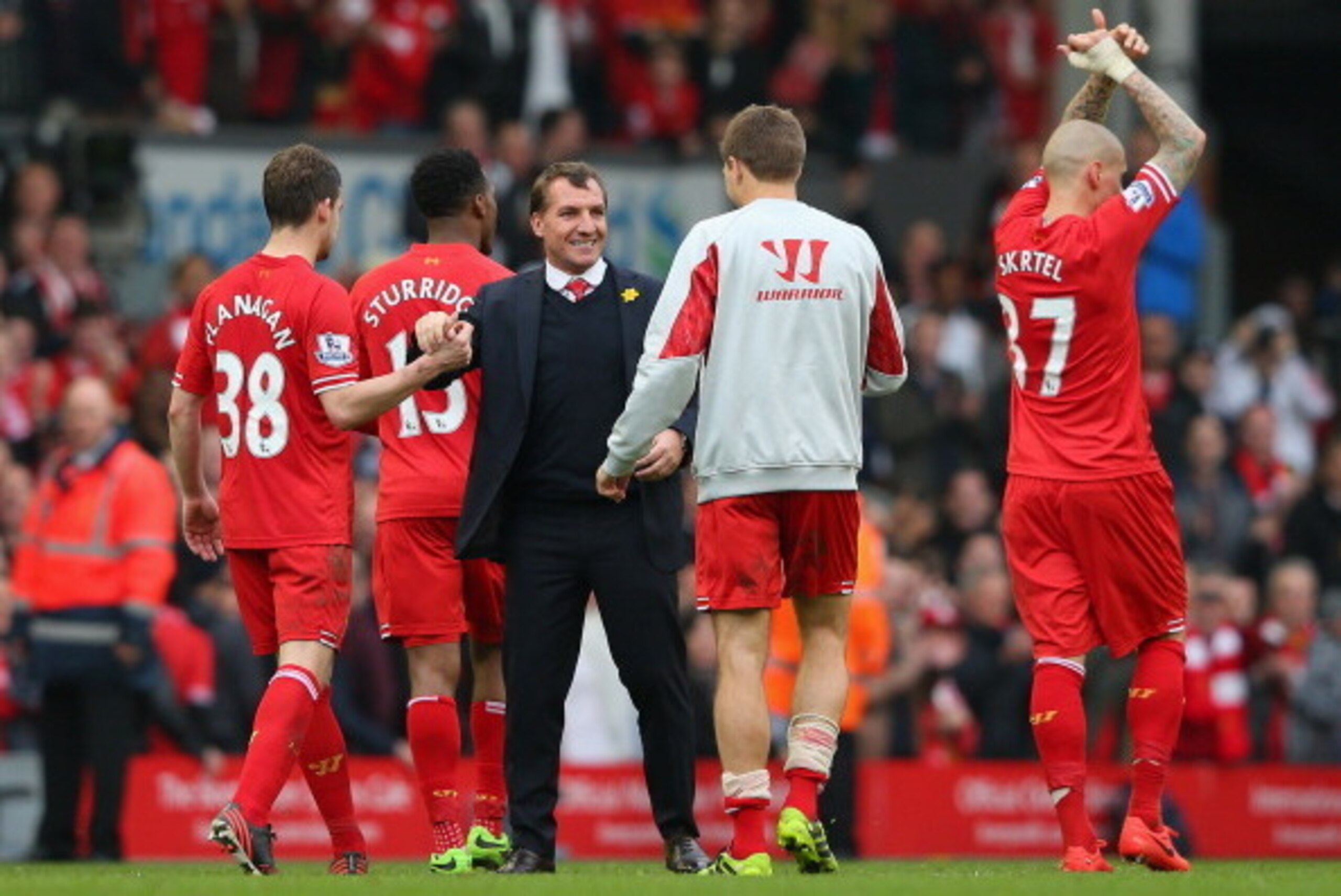 LIVERPOOL, ENGLAND - MARCH 30:  Liverpool Manager Brendan Rodgers congratulates Jon Flanagan and Steven Gerrard of Liverpool at the end of the Barclays Premier League match between Liverpool and Tottenham Hotspur at Anfield on March 30, 2014 in Liverpool,