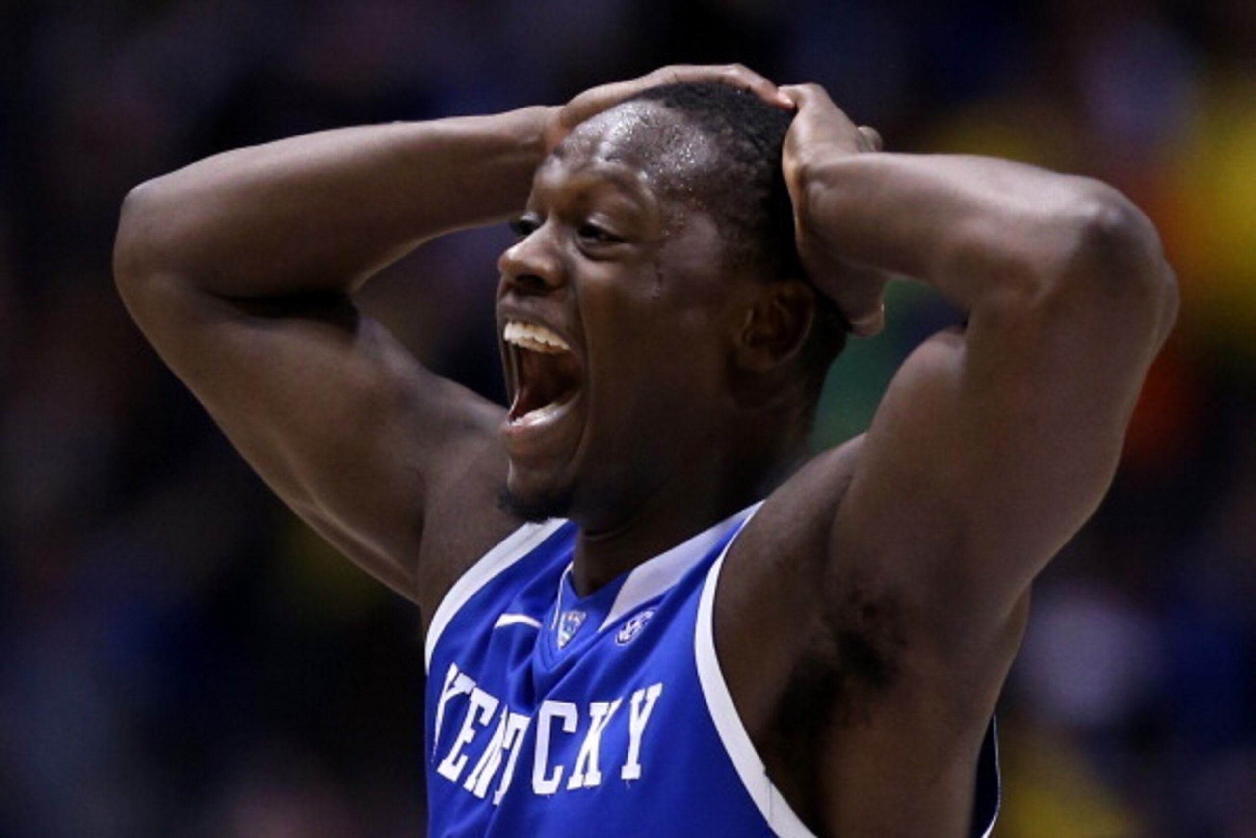 INDIANAPOLIS, IN - MARCH 30: Julius Randle #30 of the Kentucky Wildcats celebrates after defeating the Michigan Wolverines 75 to 72 in the midwest regional final of the 2014 NCAA Men's Basketball Tournament at Lucas Oil Stadium on March 30, 2014 in India INDIANAPOLIS, IN - MARCH 30: Julius Randle #30 of the Kentucky Wildcats celebrates after defeating the Michigan Wolverines 75 to 72 in the midwest regional final of the 2014 NCAA Men's Basketball Tournament at Lucas Oil Stadium on March 30, 2014 in India