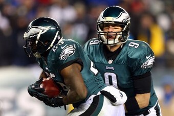 PHILADELPHIA, PA - JANUARY 04:   Nick Foles #9 hands the ball off to LeSean McCoy #25 of the Philadelphia Eagles to score a 1 yard touchdown in the third quarter against the New Orleans Saints during their NFC Wild Card Playoff game at Lincoln Financial F