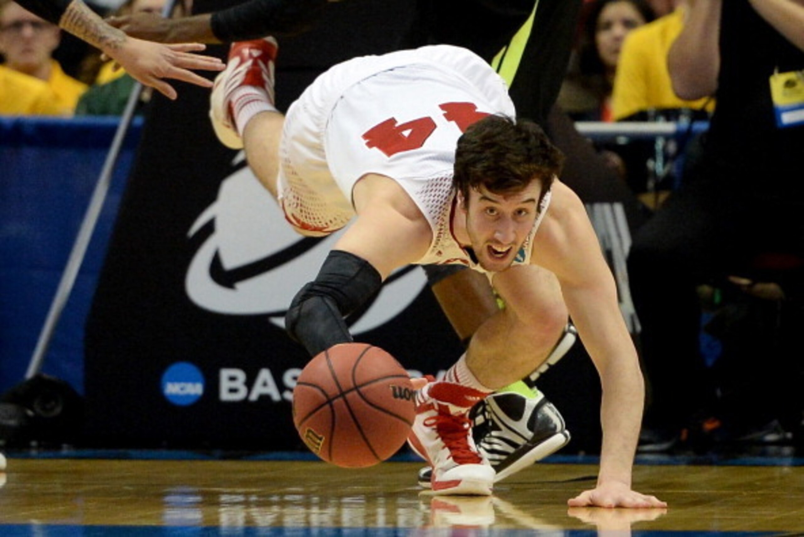 ANAHEIM, CA - MARCH 27:  Frank Kaminsky #44 of the Wisconsin Badgers goes after a loose ball in the second half while taking on the Baylor Bears during the regional semifinal of the 2014 NCAA Men's Basketball Tournament at the Honda Center on March 27, 20
