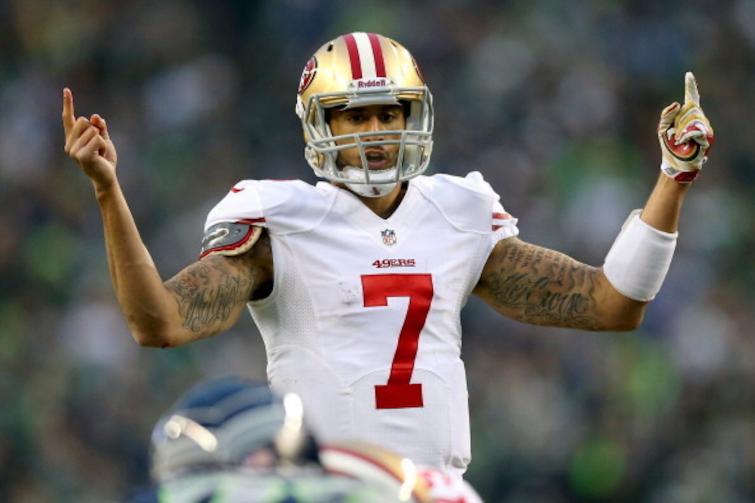 SEATTLE, WA - JANUARY 19: Quarterback Colin Kaepernick #7 of the San Francisco 49ers under center in the first half against the Seattle Seahawks during the 2014 NFC Championship at CenturyLink Field on January 19, 2014 in Seattle, Washington. (Photo by SEATTLE, WA - JANUARY 19: Quarterback Colin Kaepernick #7 of the San Francisco 49ers under center in the first half against the Seattle Seahawks during the 2014 NFC Championship at CenturyLink Field on January 19, 2014 in Seattle, Washington. (Photo by