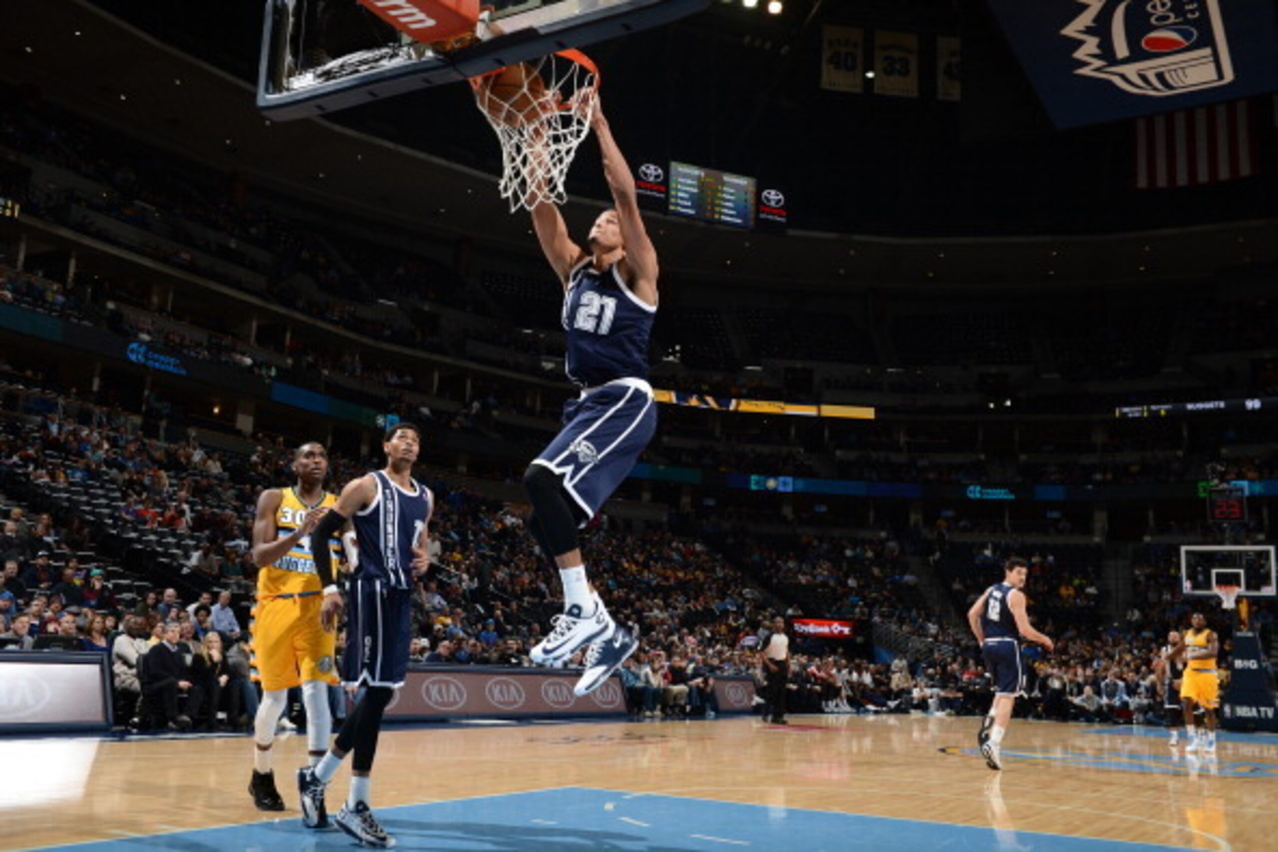 DENVER, CO - JANUARY 9: Andre Roberson #21 of the Oklahoma City Thunder dunks against the Denver Nuggets on January 9, 2014 at the Pepsi Center in Denver, Colorado. NOTE TO USER: User expressly acknowledges and agrees that, by downloading and/or using thi
