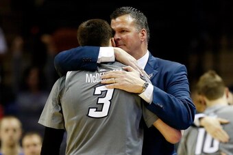 SAN ANTONIO, TX - MARCH 23:  Head coach Greg McDermott hugs Doug McDermott #3 of the Creighton Bluejays in the closing minutes of their game against the Baylor Bears in the third round of the 2014 NCAA Men's Basketball Tournament at the AT&T Center on Mar