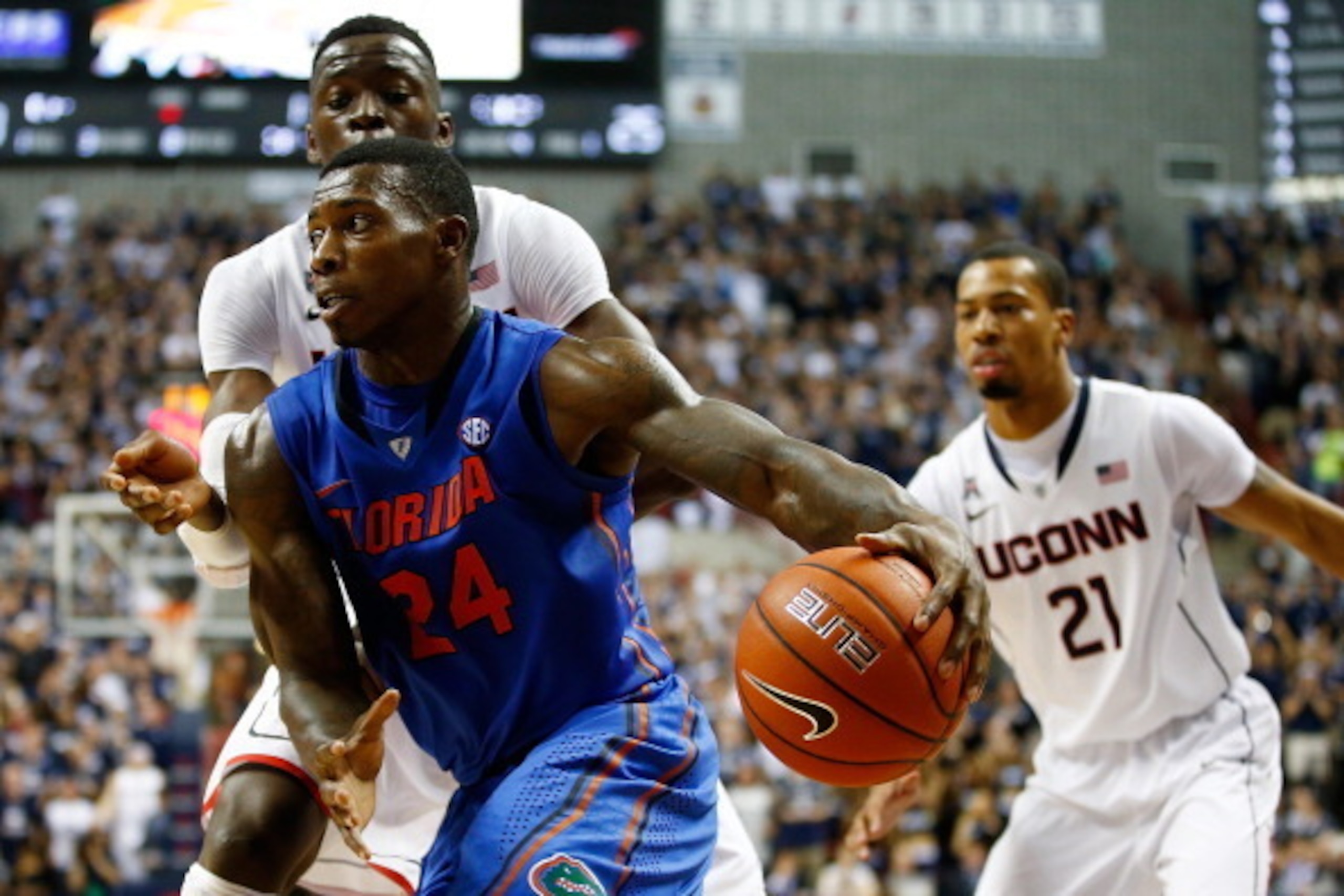 STORRS, CT - DECEMBER 02: Casey Prather #24 of the Florida Gators drives to the basket against the Connecticut Huskies during the game at Harry A. Gampel Pavilion on December 2, 2013 in Storrs, Connecticut.  (Photo by Jared Wickerham/Getty Images)