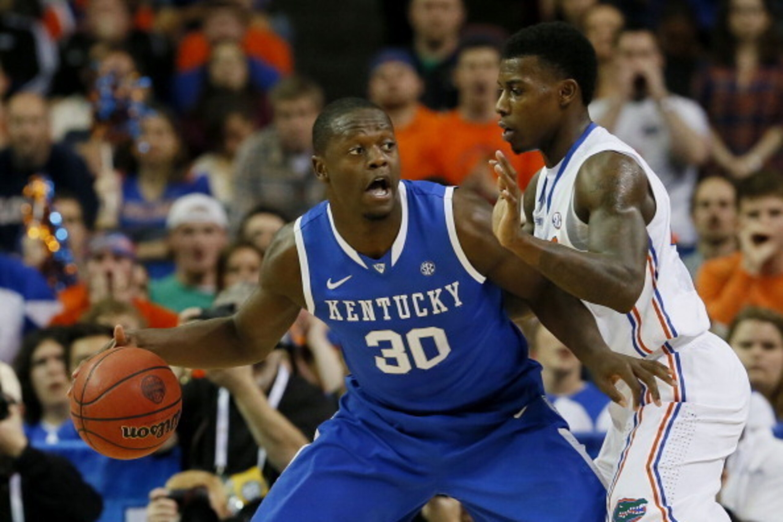 ATLANTA, GA - MARCH 16:  Julius Randle #30 of the Kentucky Wildcats drives against Casey Prather #24 of the Florida Gators in the first half during the Championship game of the 2014 Men's SEC Basketball Tournament at Georgia Dome on March 16, 2014 in Atla