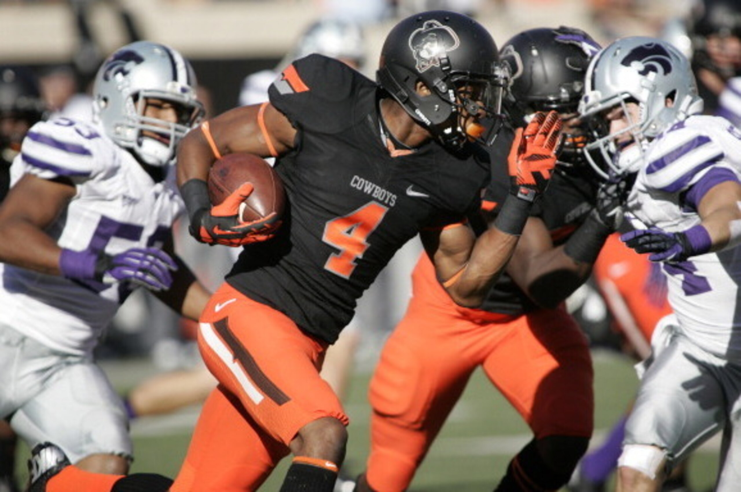STILLWATER, OK - OCTOBER 5: Cornerback Justin Gilbert #4 of the Oklahoma State Cowboys returns a kickoff against the Kansas State Wildcats October 5, 2013 at Boone Pickens Stadium in Stillwater, Oklahoma. The Cowboys defeated the Wildcats 33-29. (Photo STILLWATER, OK - OCTOBER 5: Cornerback Justin Gilbert #4 of the Oklahoma State Cowboys returns a kickoff against the Kansas State Wildcats October 5, 2013 at Boone Pickens Stadium in Stillwater, Oklahoma. The Cowboys defeated the Wildcats 33-29. (Photo