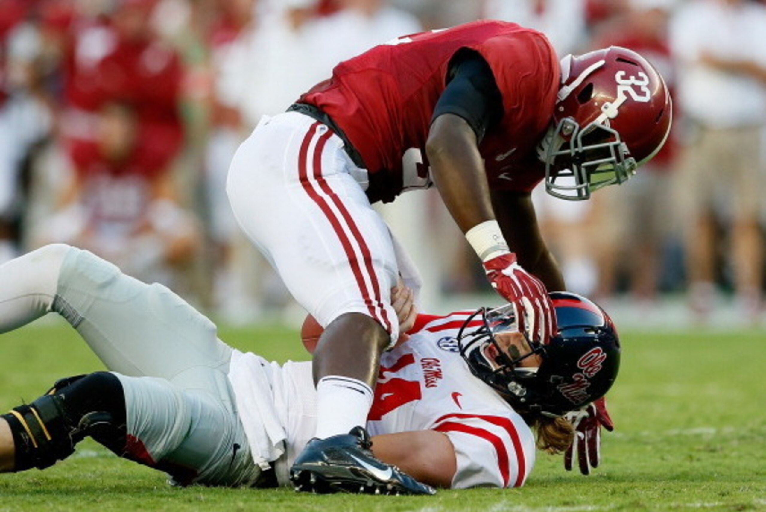 TUSCALOOSA, AL - SEPTEMBER 28: C.J. Mosley #32 of the Alabama Crimson Tide tackles Bo Wallace #14 of the Mississippi Rebels at Bryant-Denny Stadium on September 28, 2013 in Tuscaloosa, Alabama. (Photo by Kevin C. Cox/Getty Images) TUSCALOOSA, AL - SEPTEMBER 28: C.J. Mosley #32 of the Alabama Crimson Tide tackles Bo Wallace #14 of the Mississippi Rebels at Bryant-Denny Stadium on September 28, 2013 in Tuscaloosa, Alabama. (Photo by Kevin C. Cox/Getty Images)