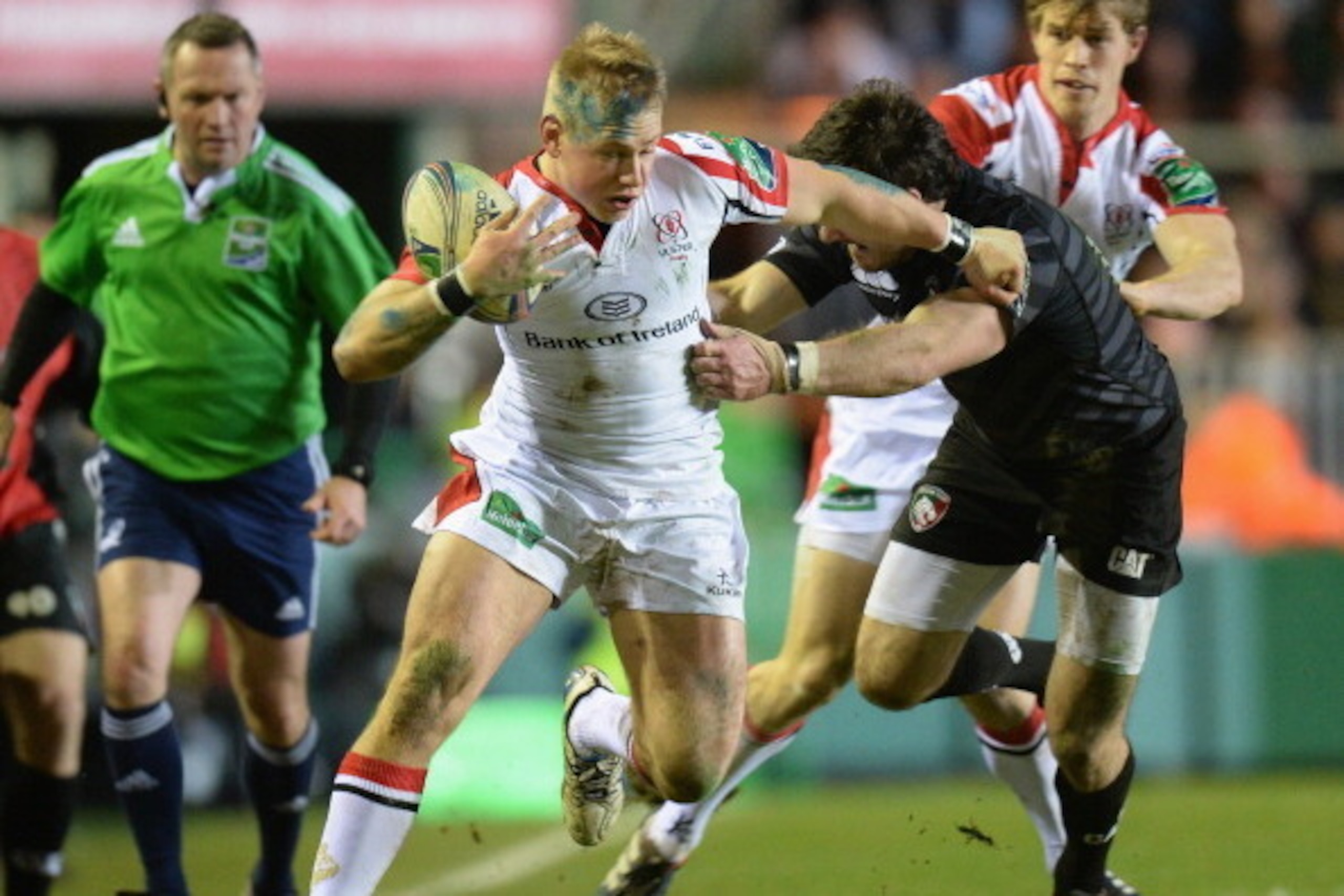 LEICESTER, ENGLAND - JANUARY 18:  Matt Smith of Leicester Tigers tackles Luke Marshall of Ulster during the Heineken Cup, round 6, pool 5 match between Leicester Tigers and Ulster at Welford Road on January 18, 2014 in Leicester, England.  (Photo by Tony 