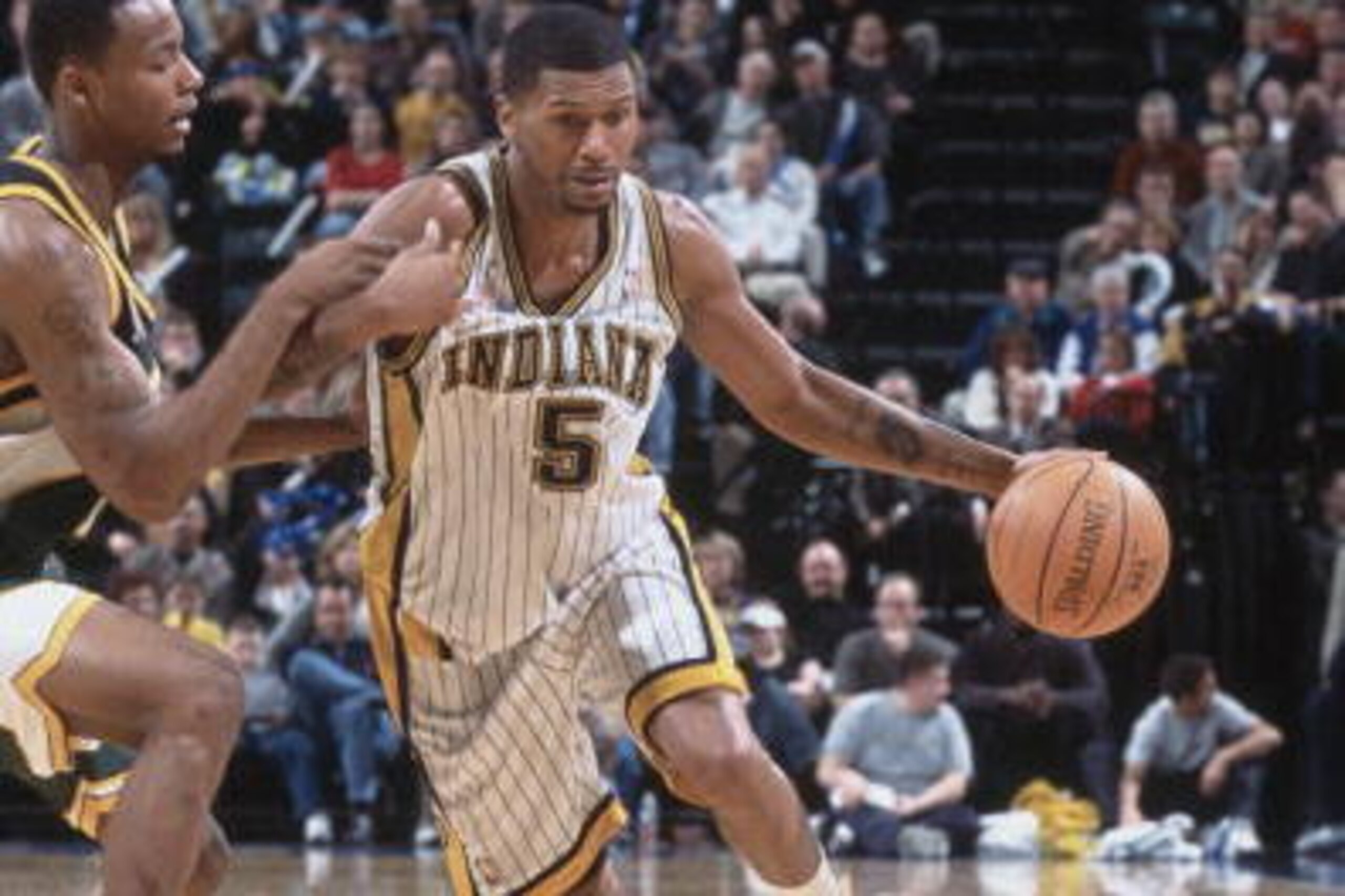 26 Jan 2002:  Guard Jalen Rose #5 of the Indiana Pacers drives past forward Rashard Lewis #7 of the Seattle SuperSonics during the NBA game at Conseco Field House in Indianapolis, Indiana.  The SuperSonics defeated the Pacers 95-86.  NOTE TO USER: User ex