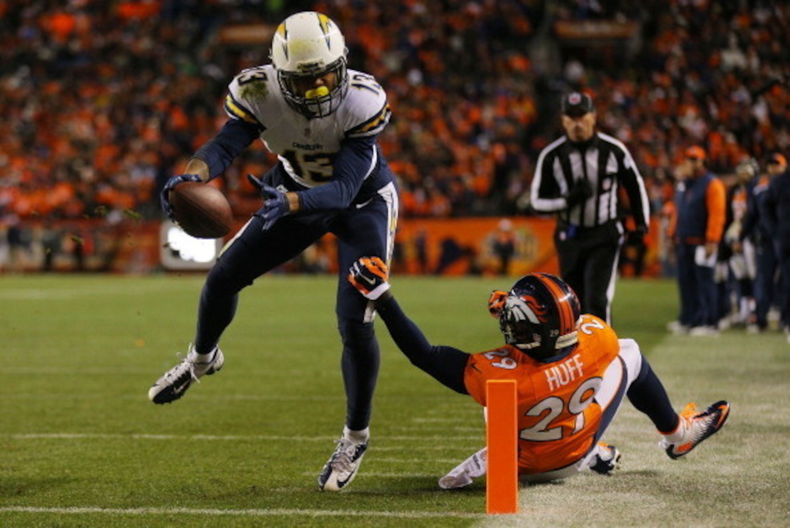 DENVER, CO - JANUARY 12:  Keenan Allen #13 of the San Diego Chargers scores a fourth quarter touchdown against  Michael Huff #29 of the Denver Broncos during the AFC Divisional Playoff Game at Sports Authority Field at Mile High on January 12, 2014 in Den