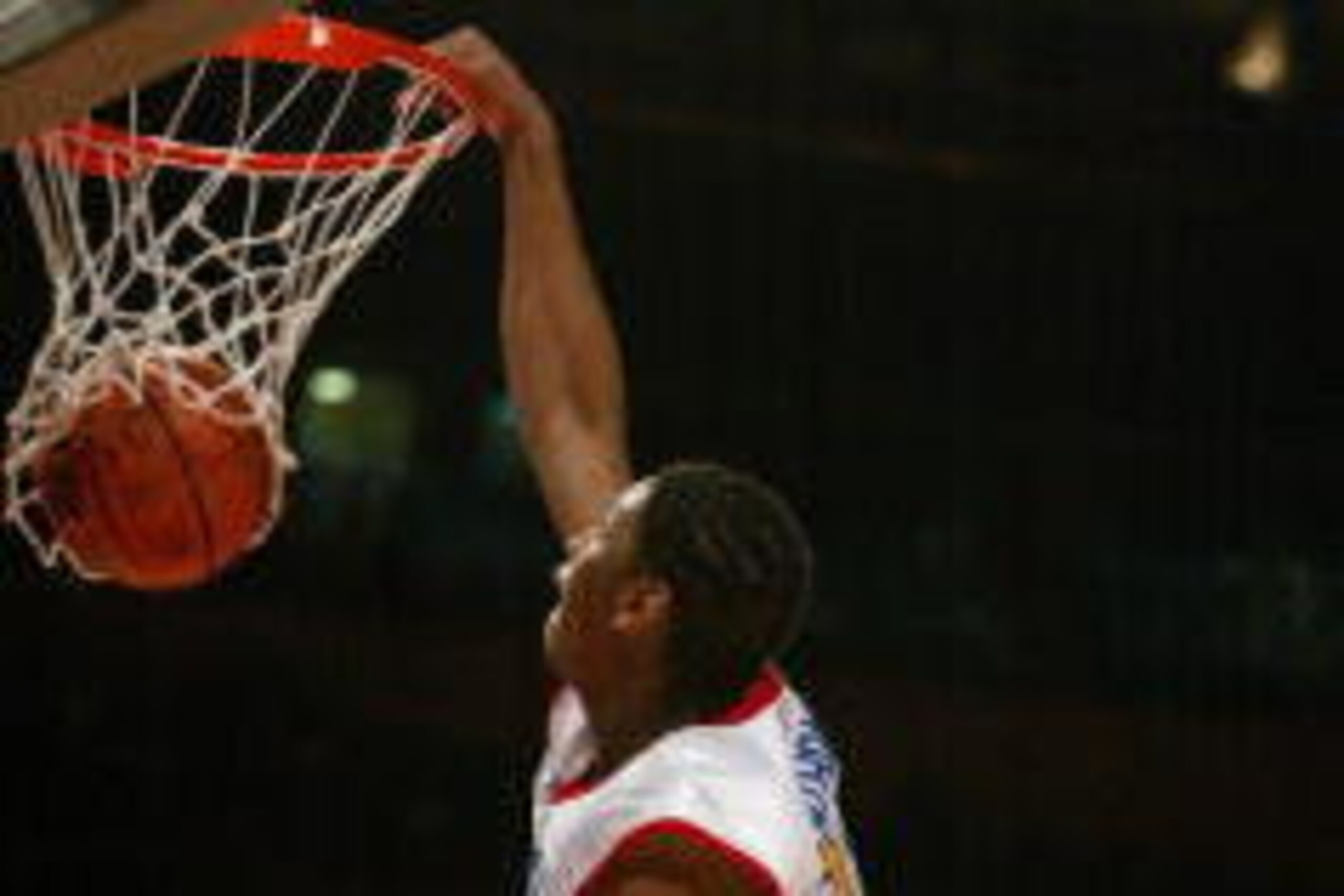 04 April 2002:  Carmelo Anthony #22 of the East team dunks over the defense of the West team during the McDonalds boys High School All America Game at Madison Square Garden in New York City,  New York. The East team defeated the West team 138-107.  Digita