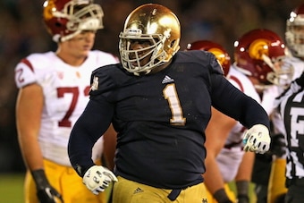 SOUTH BEND, IN - OCTOBER 19: Louis Nix III #1 of the Notre Dame Fighting Irish celebrates near the end of the game against the University of Southern California Trojans at Notre Dame Stadium on October 19, 2013 in South Bend, Indiana. Notre Dame defeated 
