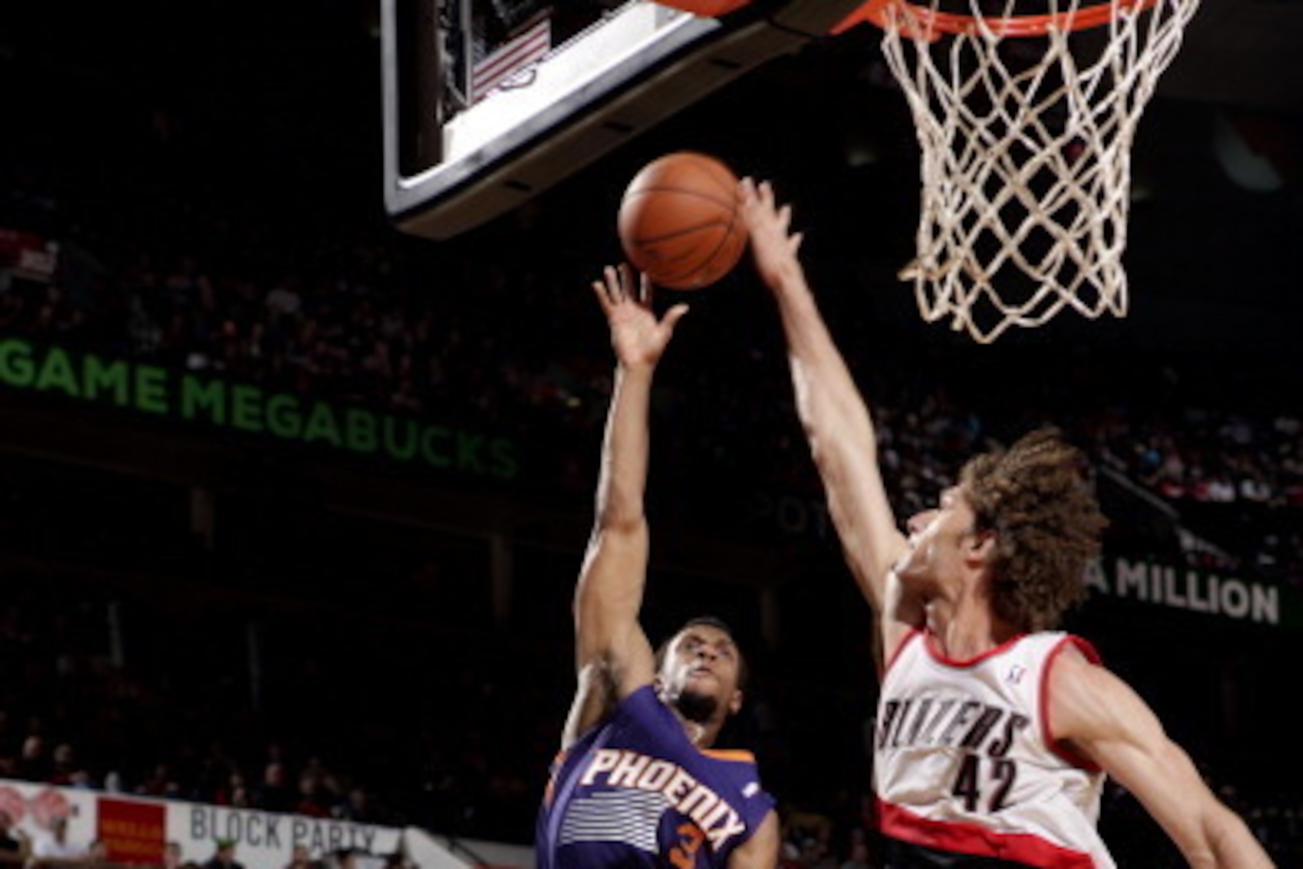 PORTLAND, OR - APRIL 4: Ish Smith #3 of the Phoenix Suns shoots against Robin Lopez #42 of the Portland Trail Blazers on April 4, 2014 at the Moda Center Arena in Portland, Oregon. NOTE TO USER: User expressly acknowledges and agrees that, by downloading 