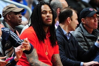 ATLANTA, GA - FEBRUARY 4:  Rapper Waka Flocka Flame watches the Atlanta Hawks take on the Indiana Pacers on February 4, 2014 at Philips Arena in Atlanta, Georgia.  NOTE TO USER: User expressly acknowledges and agrees that, by downloading and/or using this