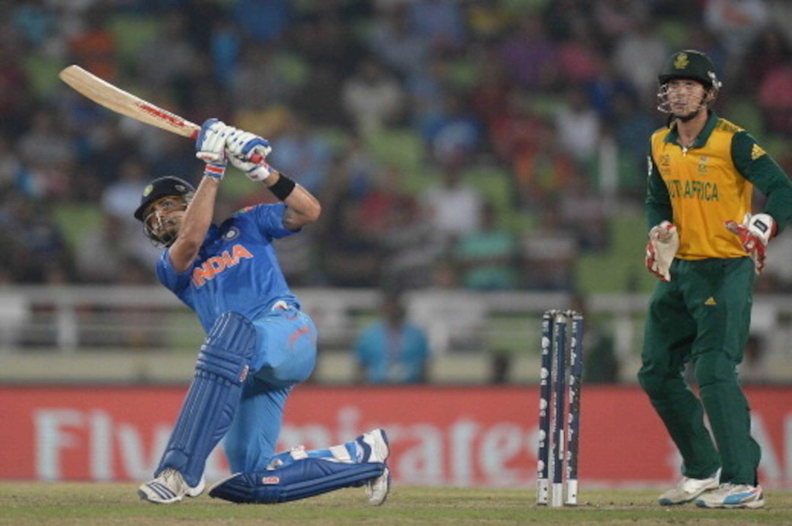 DHAKA, BANGLADESH - APRIL 04: Virat Kohli of India hits out for six runs during the ICC World Twenty20 Bangladesh 2014 semi final between India and South Africa at Sher-e-Bangla Mirpur Stadium on April 4, 2014 in Dhaka, Bangladesh. (Photo by Gareth Copl DHAKA, BANGLADESH - APRIL 04: Virat Kohli of India hits out for six runs during the ICC World Twenty20 Bangladesh 2014 semi final between India and South Africa at Sher-e-Bangla Mirpur Stadium on April 4, 2014 in Dhaka, Bangladesh. (Photo by Gareth Copl