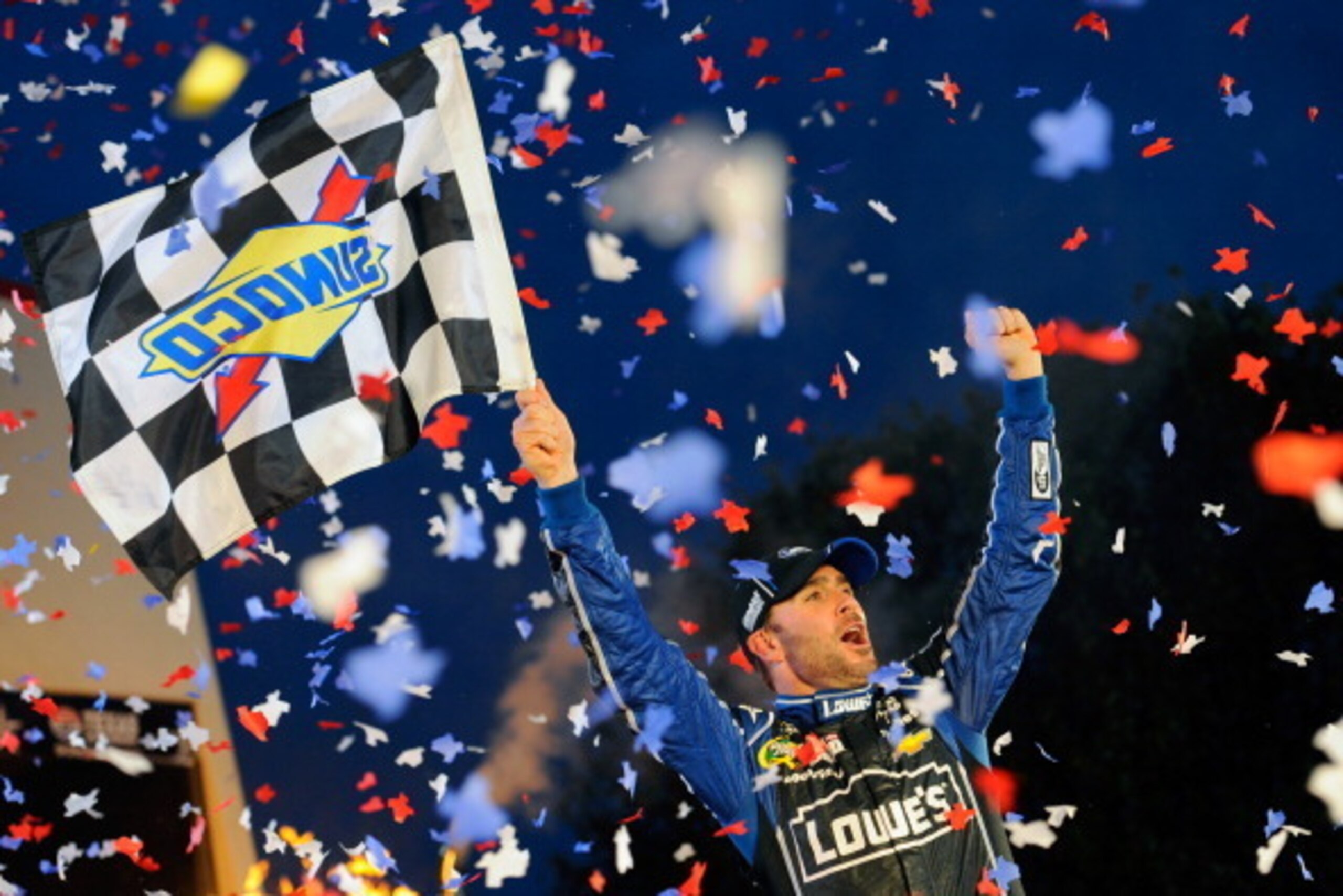 FORT WORTH, TX - NOVEMBER 03:  Jimmie Johnson, driver of the #48 Lowe's Chevrolet, celebrates in Victory Lane after winning the NASCAR Sprint Cup Series AAA Texas 500 at Texas Motor Speedway on November 3, 2013 in Fort Worth, Texas.  (Photo by Jared C. Ti