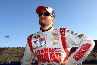 FONTANA, CA - MARCH 21:  Dale Earnhardt Jr., driver of the #88 National Guard Chevrolet, stands on the grid during qualifying for the NASCAR Sprint Cup Series Auto Club 400 at Auto Club Speedway on March 21, 2014 in Fontana, California.  (Photo by Jerry M