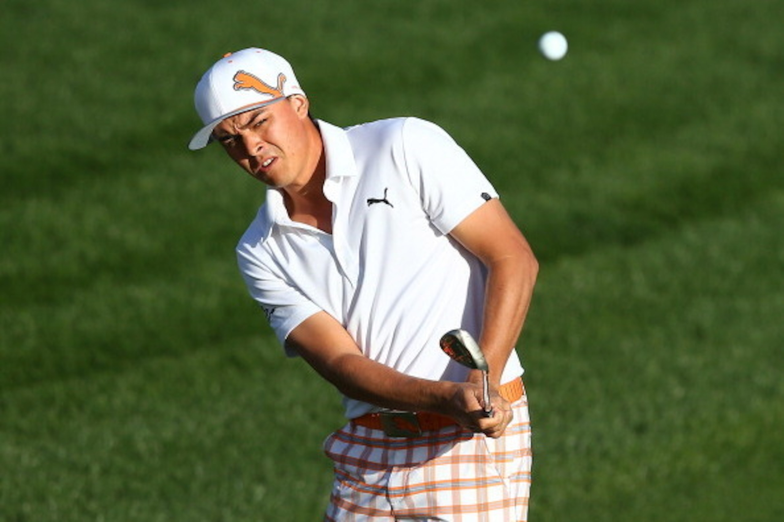 MARANA, AZ - FEBRUARY 23:  Rickie Fowler of USA plays his third shot on the seventh hole during the semifinal round of the World Golf Championships - Accenture Match Play Championship at The Golf Club at Dove Mountain on February 23, 2014 in Marana, Arizo